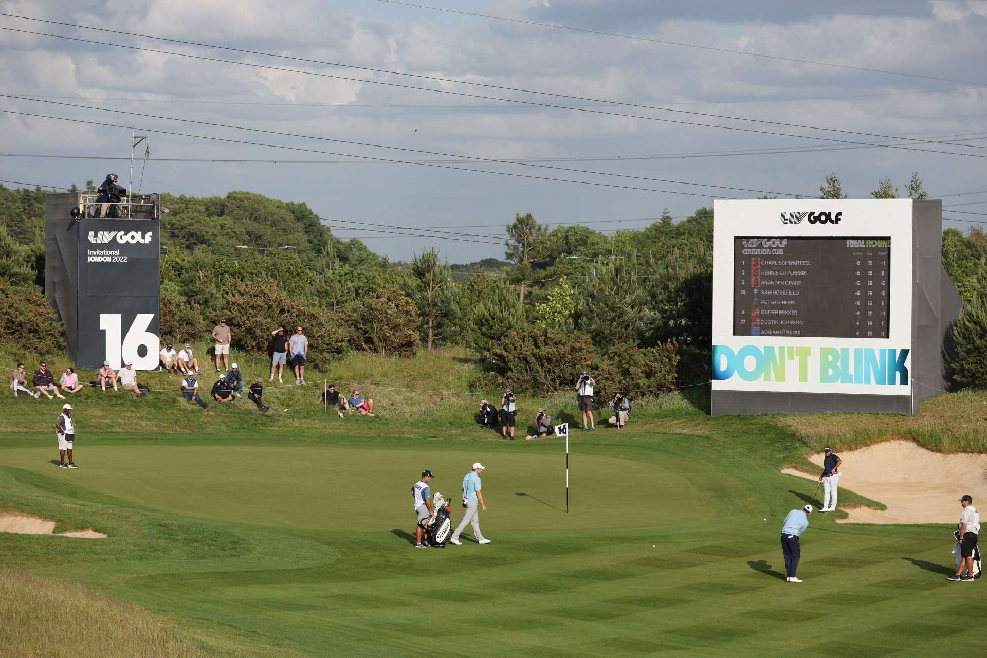 South African golfer Charl Schwartzel (R) plays a shot on the 16th hole during the third and final day of the LIV Golf Invitational Series event at The Centurion Club in St Albans, north of London, on June 11, 2022. - The LIV Golf Invitational London, the launch event of a lucrative and divisive series that is rocking the sport reaches it's conclusion. The $25 million event in St Albans -- the biggest prize pot in history -- is the first of eight tournaments this year bankrolled by Saudi Arabia's sovereign wealth fund, worth a combined $255 million. (Photo by Adrian DENNIS / AFP) (Photo by ADRIAN DENNIS/AFP via Getty Images)