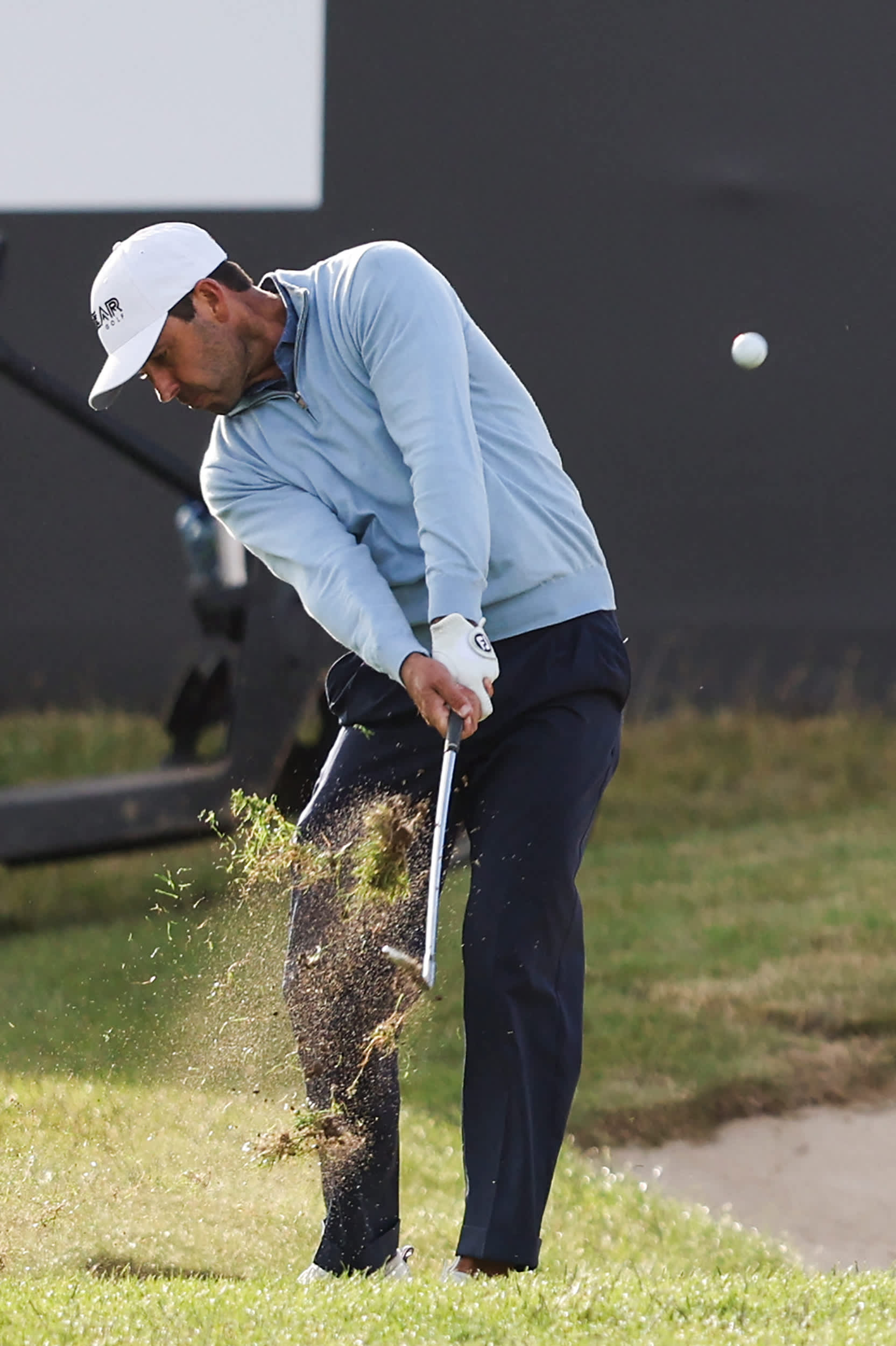 South African golfer Charl Schwartzel plays a shot on the 16th hole during the third and final day of the LIV Golf Invitational Series event at The Centurion Club in St Albans, north of London, on June 11, 2022. - The LIV Golf Invitational London, the launch event of a lucrative and divisive series that is rocking the sport reaches it's conclusion. The $25 million event in St Albans -- the biggest prize pot in history -- is the first of eight tournaments this year bankrolled by Saudi Arabia's sovereign wealth fund, worth a combined $255 million. (Photo by Adrian DENNIS / AFP) (Photo by ADRIAN DENNIS/AFP via Getty Images)