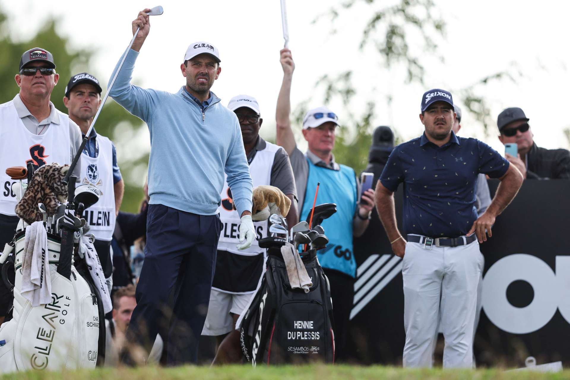 South African golfers Charl Schwartzel (L) and Hennie du Plessis (R) arrive to play on the 16th hole during the third and final day of the LIV Golf Invitational Series event at The Centurion Club in St Albans, north of London, on June 11, 2022. - The LIV Golf Invitational London, the launch event of a lucrative and divisive series that is rocking the sport reaches it's conclusion. The $25 million event in St Albans -- the biggest prize pot in history -- is the first of eight tournaments this year bankrolled by Saudi Arabia's sovereign wealth fund, worth a combined $255 million. (Photo by Adrian DENNIS / AFP) (Photo by ADRIAN DENNIS/AFP via Getty Images)