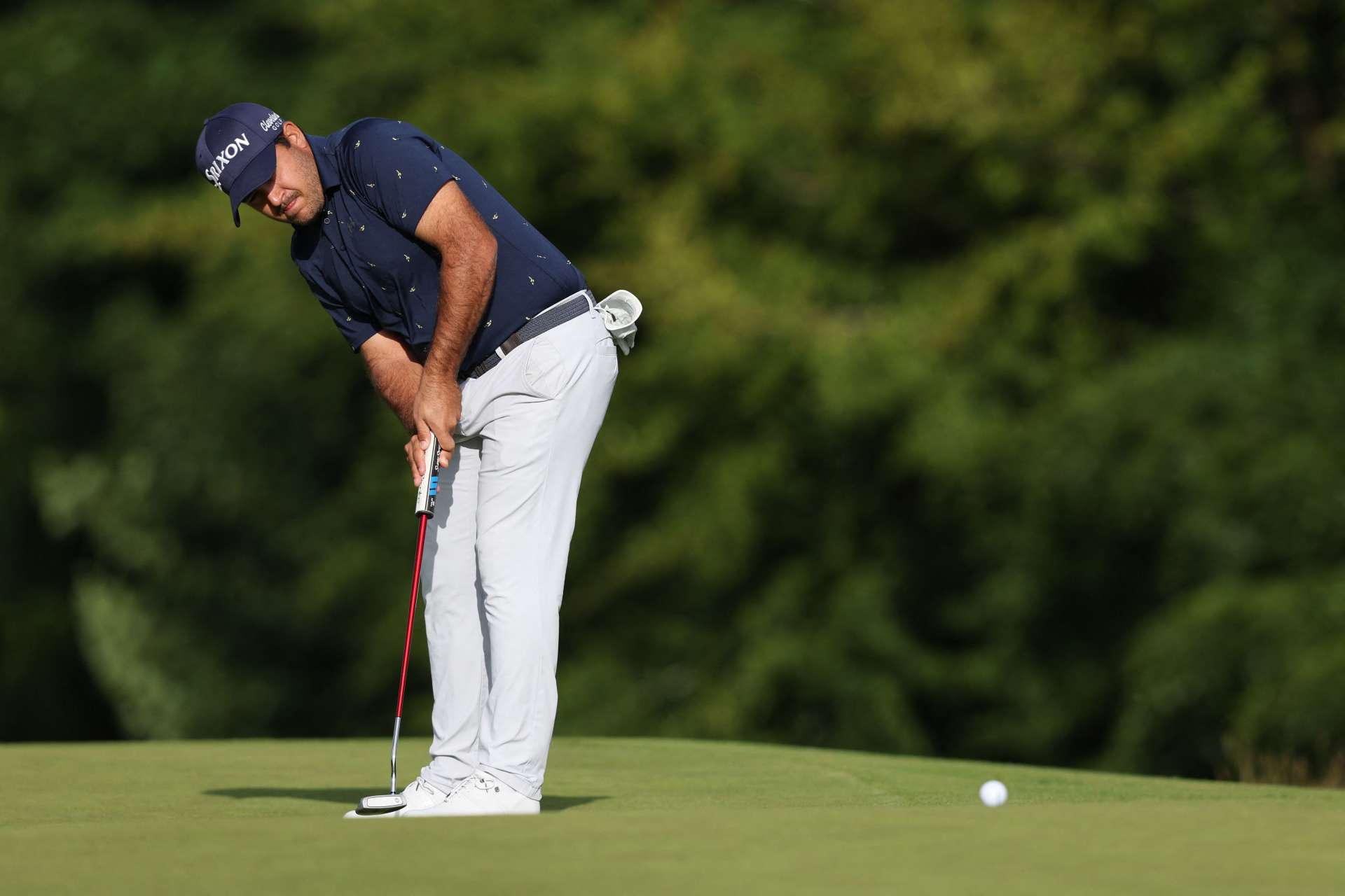 South African golfer Hennie du Plessis chips onto the 15th green on the third and final day of the LIV Golf Invitational Series event at The Centurion Club in St Albans, north of London, on June 11, 2022. - The LIV Golf Invitational London, the launch event of a lucrative and divisive series that is rocking the sport reaches it's conclusion. The $25 million event in St Albans -- the biggest prize pot in history -- is the first of eight tournaments this year bankrolled by Saudi Arabia's sovereign wealth fund, worth a combined $255 million. (Photo by Adrian DENNIS / AFP) (Photo by ADRIAN DENNIS/AFP via Getty Images)