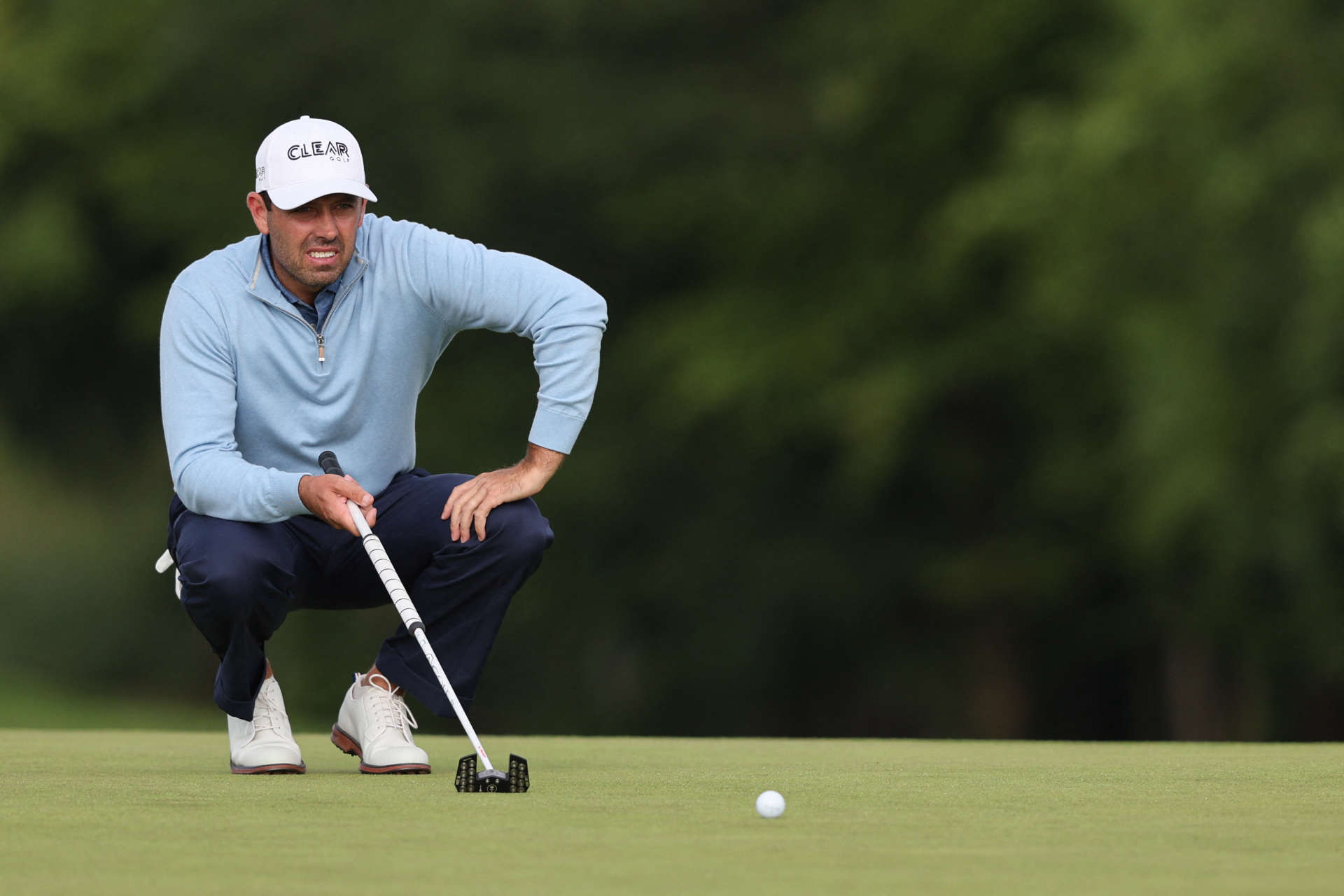 South African golfer Charl Schwartzel reacts as he chips onto the 15th green on the third and final day of the LIV Golf Invitational Series event at The Centurion Club in St Albans, north of London, on June 11, 2022. - The LIV Golf Invitational London, the launch event of a lucrative and divisive series that is rocking the sport reaches it's conclusion. The $25 million event in St Albans -- the biggest prize pot in history -- is the first of eight tournaments this year bankrolled by Saudi Arabia's sovereign wealth fund, worth a combined $255 million. (Photo by Adrian DENNIS / AFP) (Photo by ADRIAN DENNIS/AFP via Getty Images)