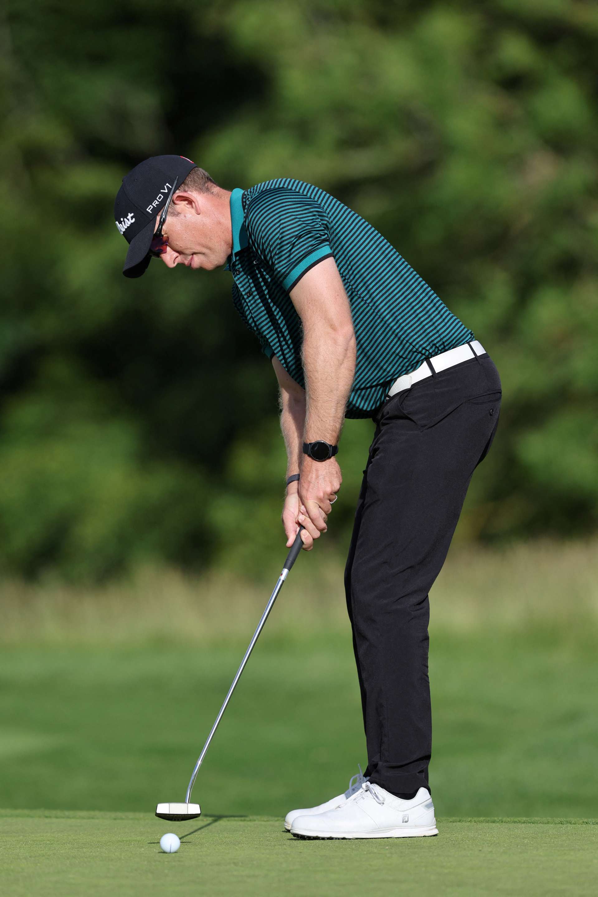 South African golfer Oliver Bekker chips onto the 15th green on the third and final day of the LIV Golf Invitational Series event at The Centurion Club in St Albans, north of London, on June 11, 2022. - The LIV Golf Invitational London, the launch event of a lucrative and divisive series that is rocking the sport reaches it's conclusion. The $25 million event in St Albans -- the biggest prize pot in history -- is the first of eight tournaments this year bankrolled by Saudi Arabia's sovereign wealth fund, worth a combined $255 million. (Photo by Adrian DENNIS / AFP) (Photo by ADRIAN DENNIS/AFP via Getty Images)