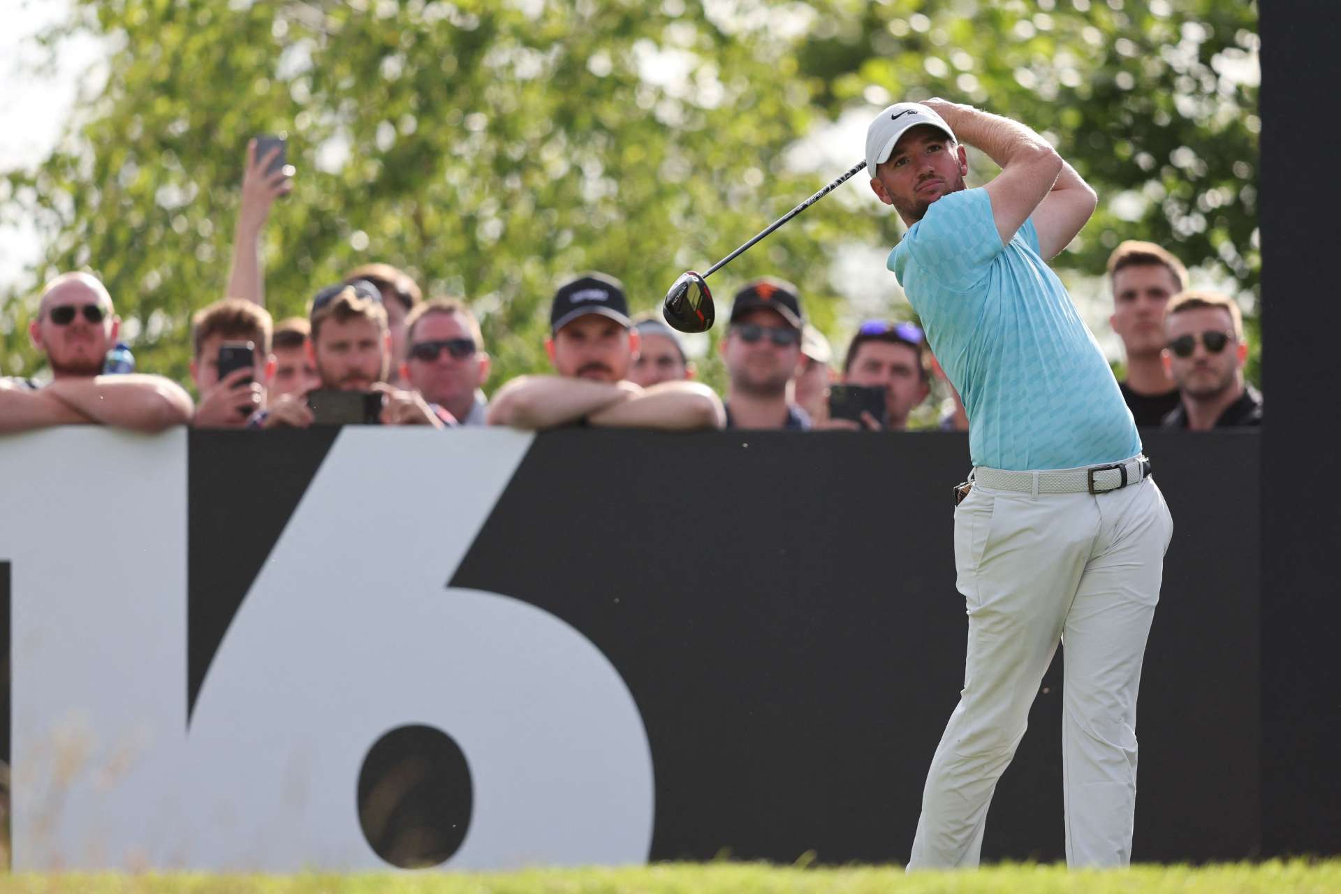 English golfer Sam Horsfield plays a shot on the 16th hole on the third and final day of the LIV Golf Invitational Series event at The Centurion Club in St Albans, north of London, on June 11, 2022. - The LIV Golf Invitational London, the launch event of a lucrative and divisive series that is rocking the sport reaches it's conclusion. The $25 million event in St Albans -- the biggest prize pot in history -- is the first of eight tournaments this year bankrolled by Saudi Arabia's sovereign wealth fund, worth a combined $255 million. (Photo by Adrian DENNIS / AFP) (Photo by ADRIAN DENNIS/AFP via Getty Images)
