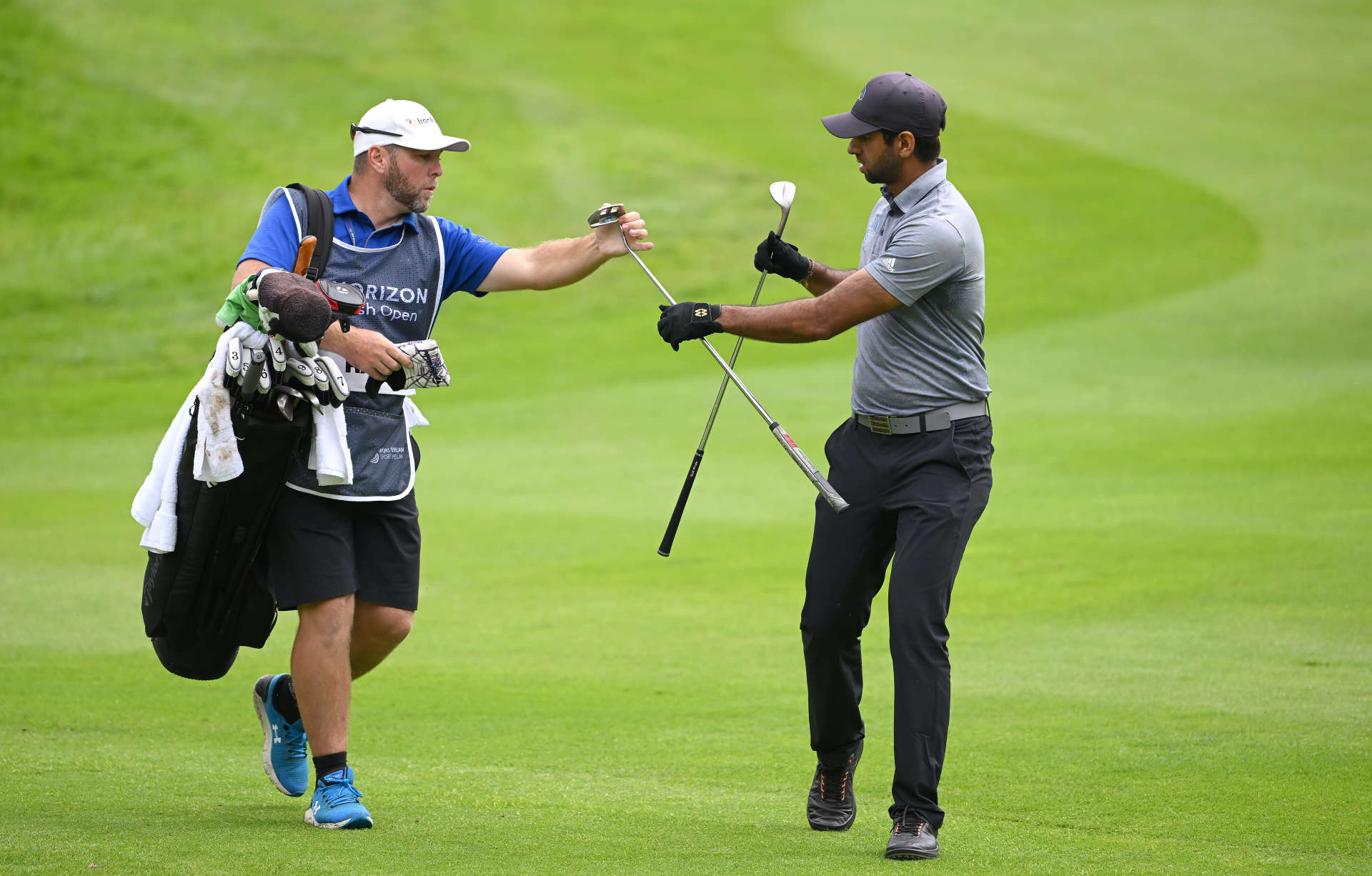 THOMASTOWN, IRELAND - JUNE 30: Aaron Rai of England exchanges clubs with his caddie on the 10th fairway during the first round of the Horizon Irish Open at Mount Juliet Estate on June 30, 2022 in Thomastown, Ireland. (Photo by Ross Kinnaird/Getty Images)