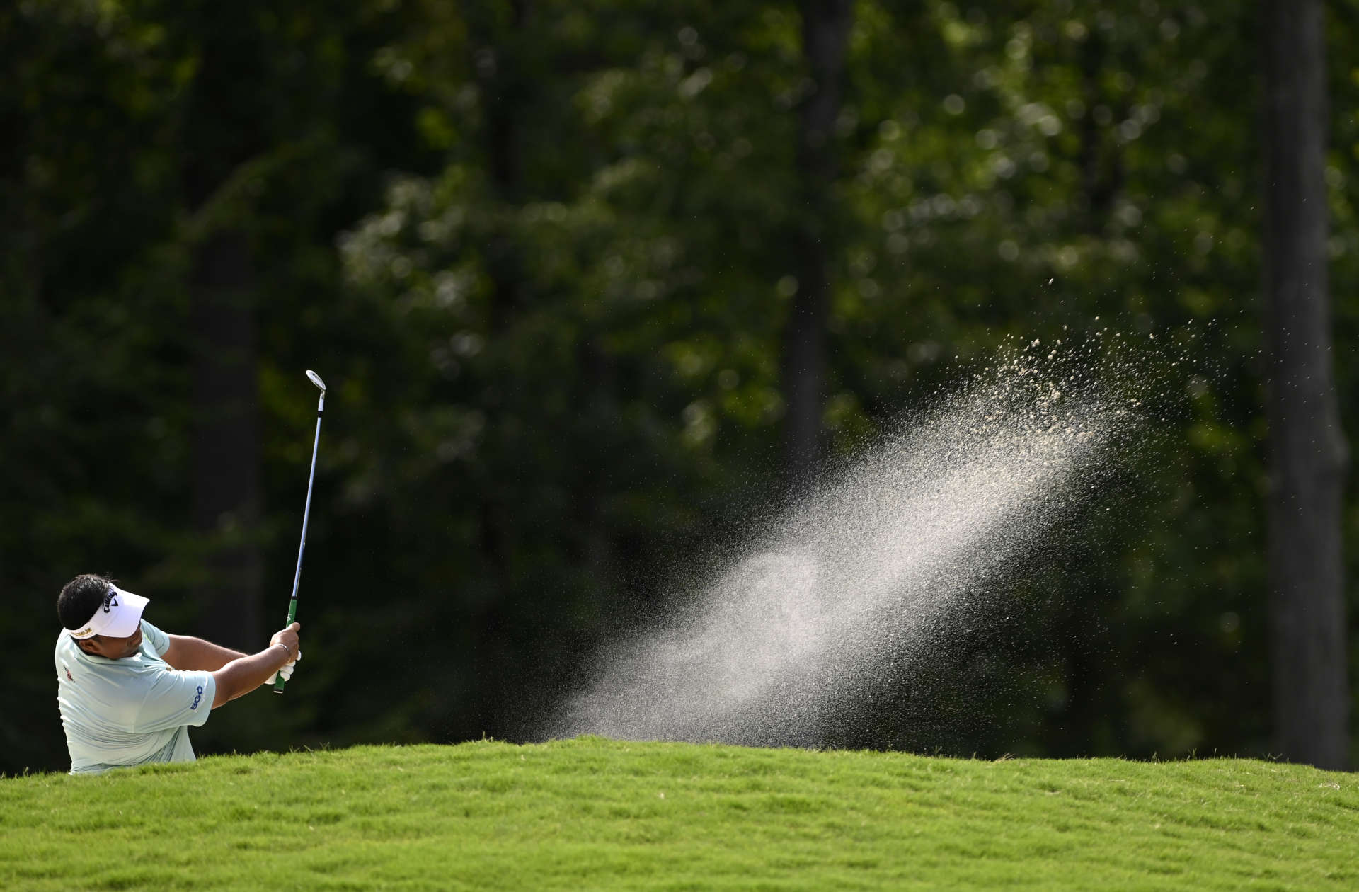 GREENSBORO, NORTH CAROLINA - AUGUST 07: Kiradech Aphibarnrat of Thailand plays a second shot on the 14th hole during the final round of the Wyndham Championship at Sedgefield Country Club on August 07, 2022 in Greensboro, North Carolina. (Photo by Eakin Howard/Getty Images)
