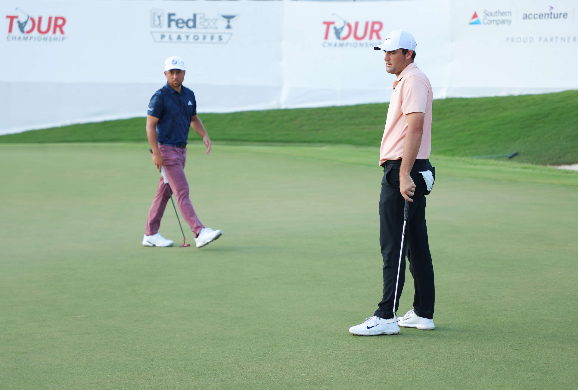 ATLANTA, GEORGIA - AUGUST 26: Scottie Scheffler of the United States and Xander Schauffele of the United States look on over the 18th green during the second round of the TOUR Championship at East Lake Golf Club on August 26, 2022 in Atlanta, Georgia. (Photo by Kevin C. Cox/Getty Images)