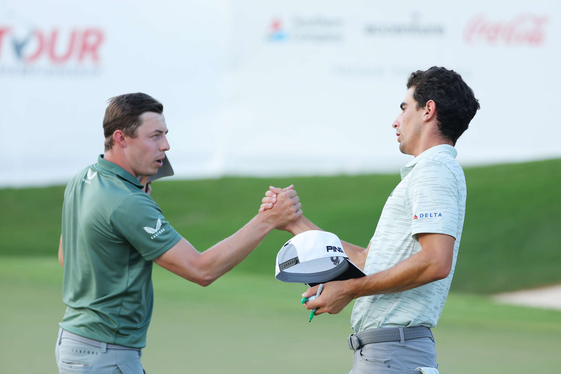 ATLANTA, GEORGIA - AUGUST 26: Matthew Fitzpatrick of England and Joaquin Niemann of Chile shake hands after finishing on the 18th green during the second round of the TOUR Championship at East Lake Golf Club on August 26, 2022 in Atlanta, Georgia. (Photo by Kevin C. Cox/Getty Images)