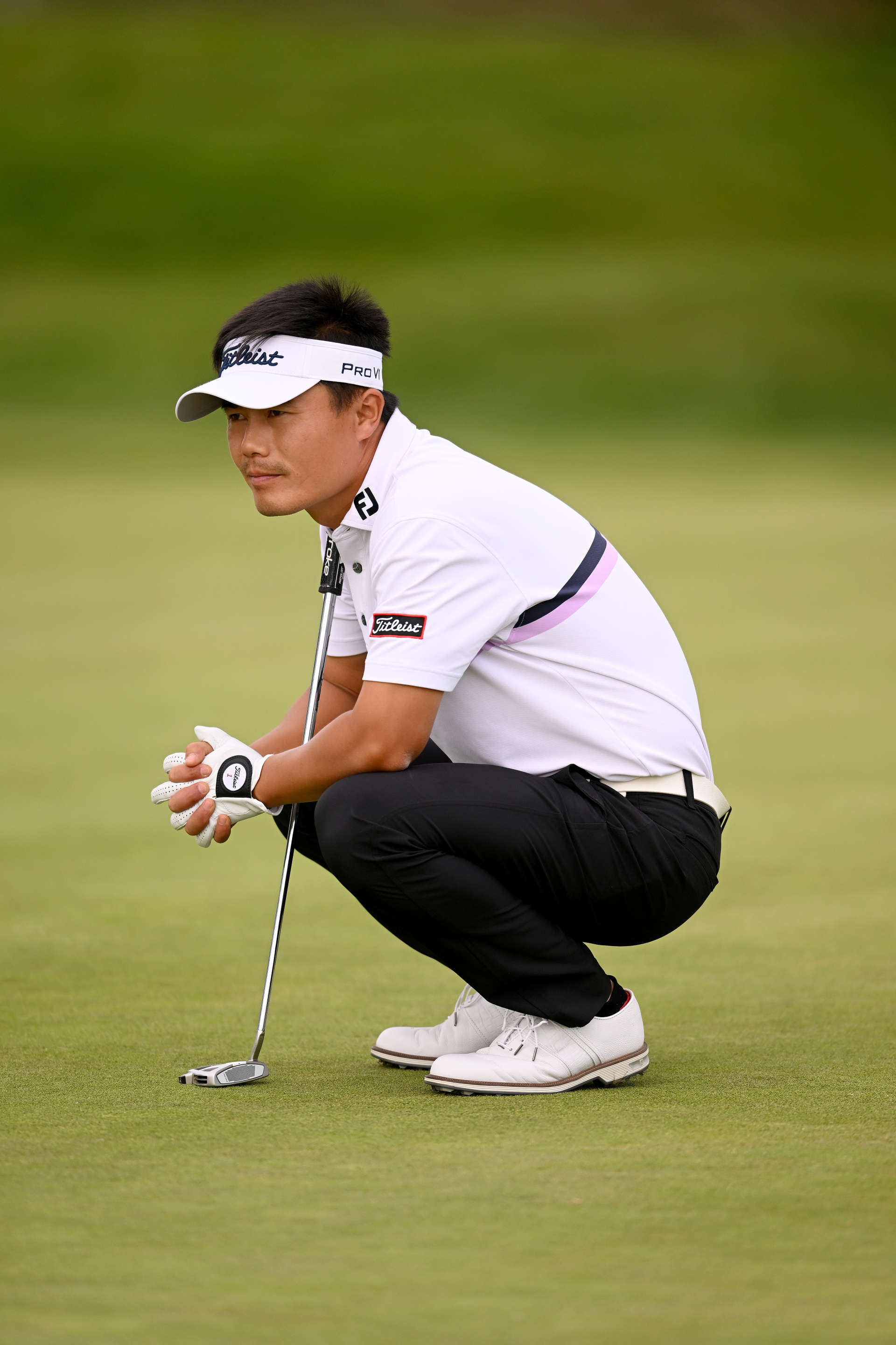 PARIS, FRANCE - SEPTEMBER 23: Huilin Zhang of China preapres tos play his putt shot from the 3rd hole on Day Two of the Cazoo Open de France at Le Golf National on September 23, 2022 in Paris, France. (Photo by Ross Kinnaird/Getty Images)
