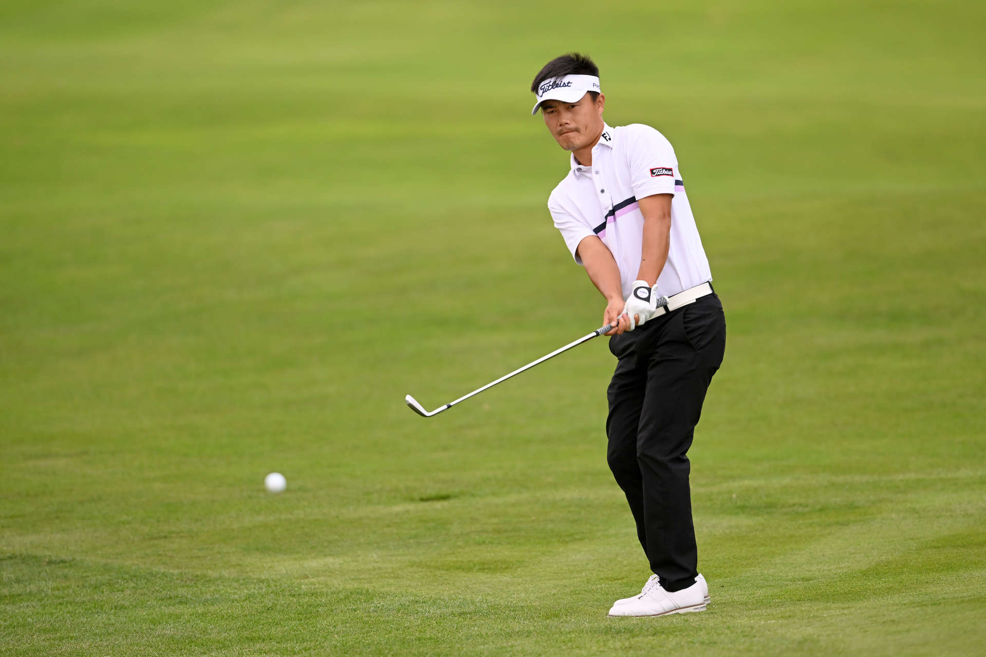 PARIS, FRANCE - SEPTEMBER 23: Huilin Zhang of China plays his chipping shot from the 3rd hole on Day Two of the Cazoo Open de France at Le Golf National on September 23, 2022 in Paris, France. (Photo by Ross Kinnaird/Getty Images)