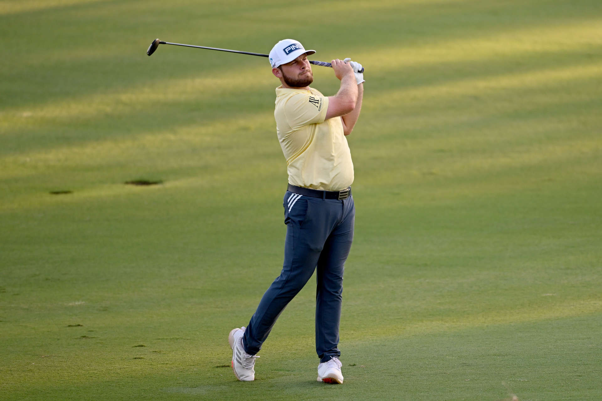DUBAI, UNITED ARAB EMIRATES - NOVEMBER 18: Tyrrel Hatton of England plays his second shot on the 18th hole during Day Two of the DP World Tour Championship on the Earth Course at Jumeirah Golf Estates on November 18, 2022 in Dubai, United Arab Emirates. (Photo by Ross Kinnaird/Getty Images)
