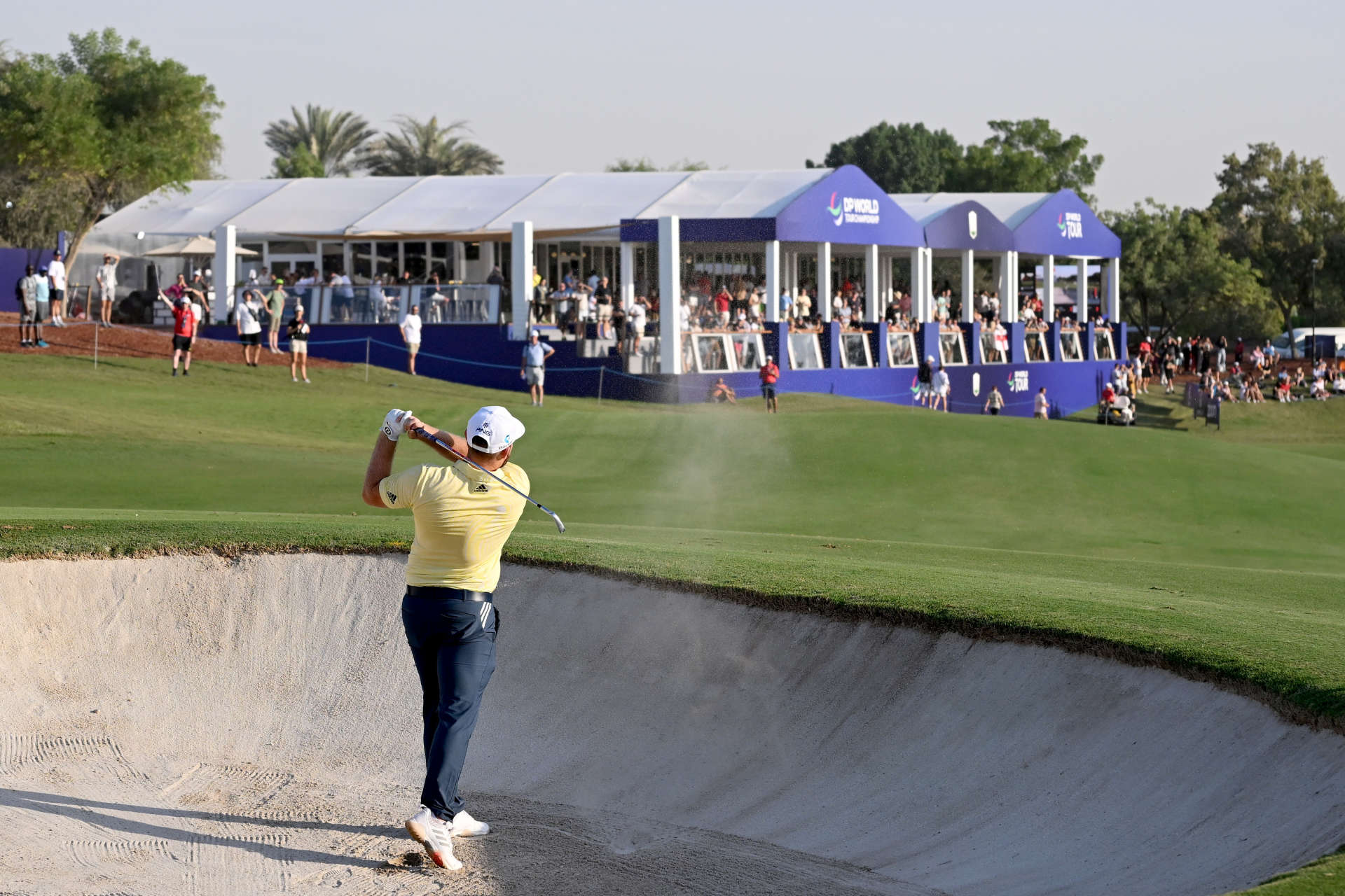 DUBAI, UNITED ARAB EMIRATES - NOVEMBER 18: Tyrrel Hatton of England plays his second shot on the 16th hole during Day Two of the DP World Tour Championship on the Earth Course at Jumeirah Golf Estates on November 18, 2022 in Dubai, United Arab Emirates. (Photo by Ross Kinnaird/Getty Images)