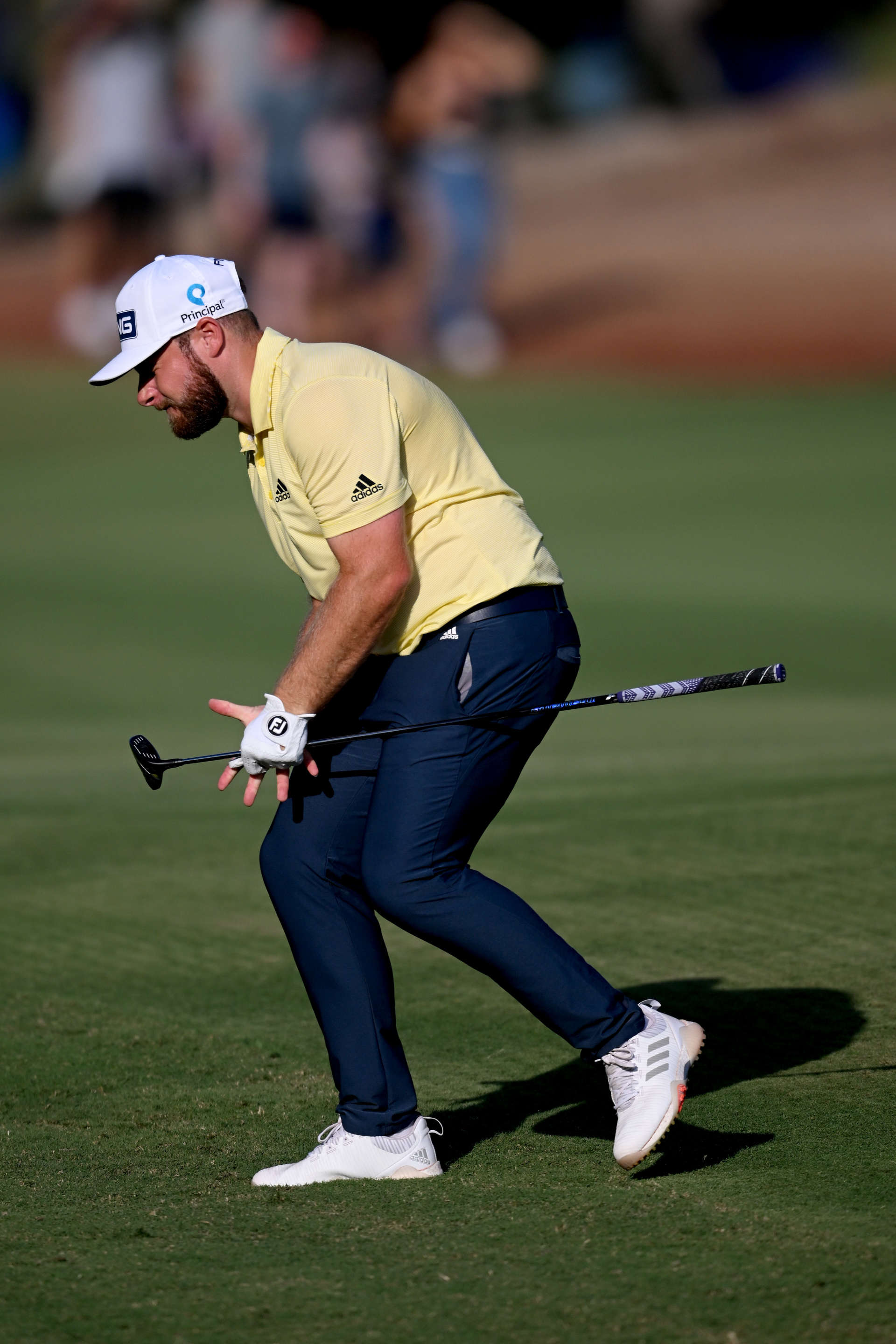 DUBAI, UNITED ARAB EMIRATES - NOVEMBER 18: Tyrrel Hatton of England reacts after playing his second shot on 14th during Day Two of the DP World Tour Championship on the Earth Course at Jumeirah Golf Estates on November 18, 2022 in Dubai, United Arab Emirates. (Photo by Ross Kinnaird/Getty Images)