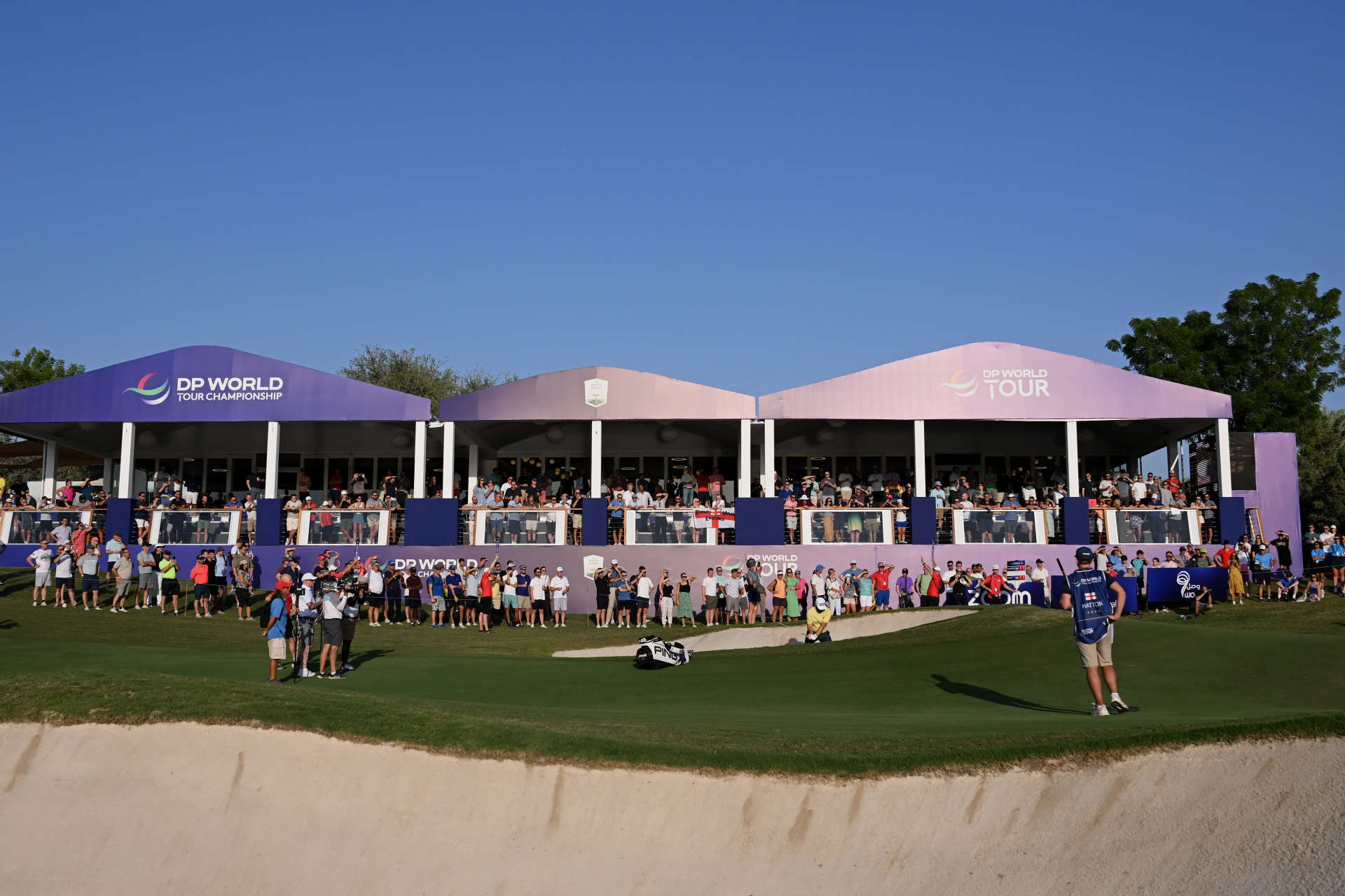 DUBAI, UNITED ARAB EMIRATES - NOVEMBER 18: Tyrrel Hatton of England plays his bunker shot on the 16th hole during Day Two of the DP World Tour Championship on the Earth Course at Jumeirah Golf Estates on November 18, 2022 in Dubai, United Arab Emirates. (Photo by Ross Kinnaird/Getty Images)