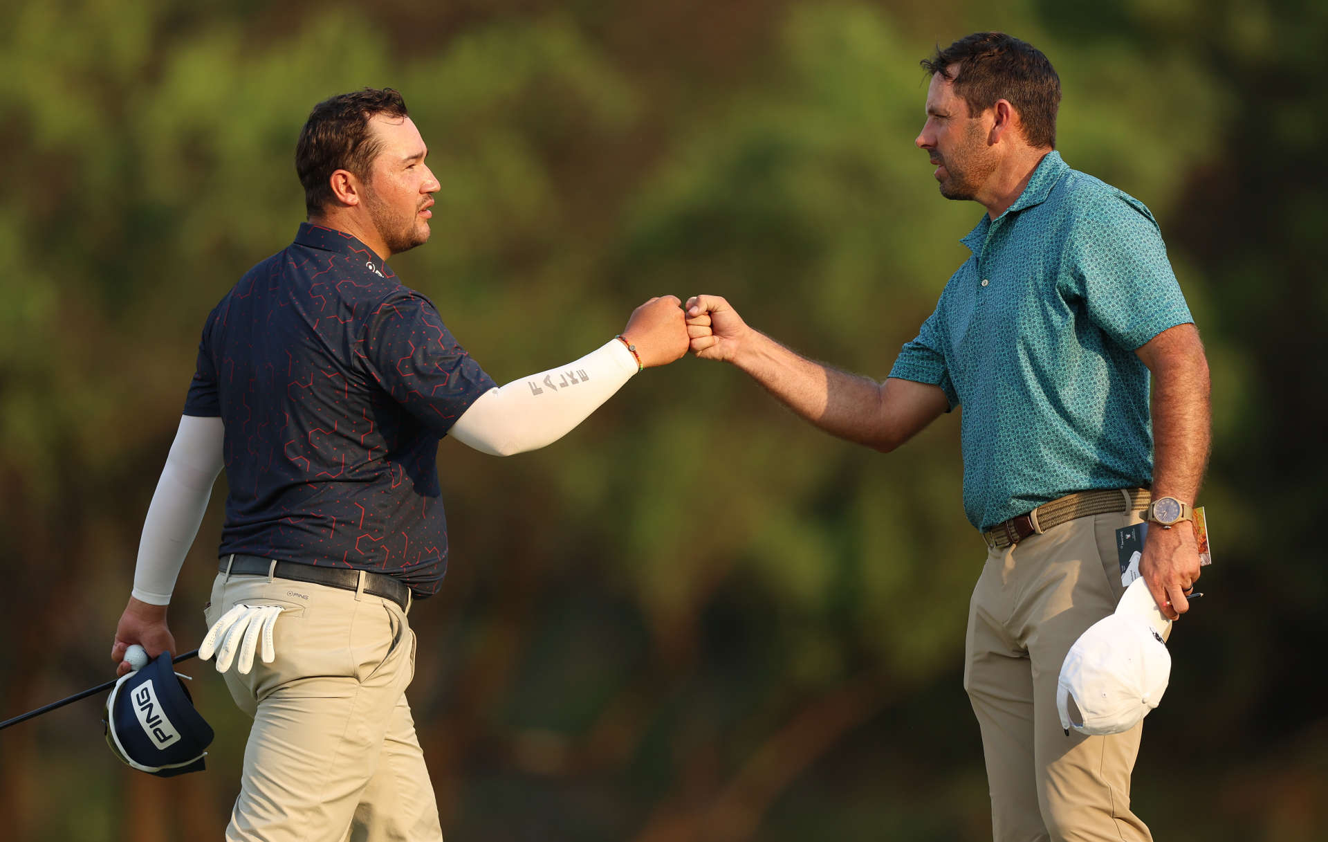 JOHANNESBURG, SOUTH AFRICA - DECEMBER 01: Thriston Lawrence of South Africa and Charl Schwartzel of South Africa shake hands on the 18th green during Day One of the Investec South African Open Championship at Blair Atholl Golf & Equestrian Estate on December 01, 2022 in Johannesburg, South Africa. (Photo by Luke Walker/Getty Images)