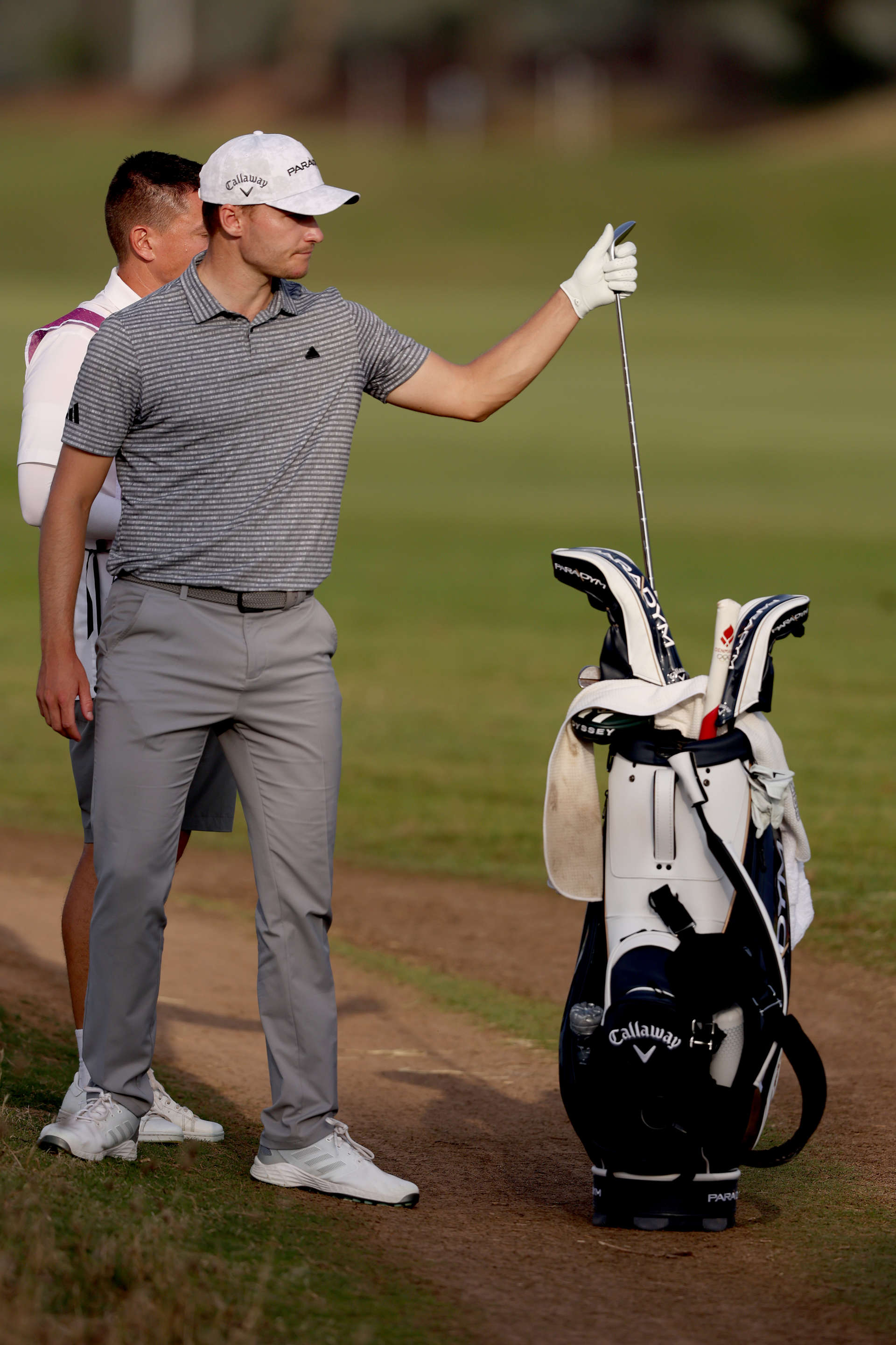 RAS AL KHAIMAH, UNITED ARAB EMIRATES - FEBRUARY 03: Rasmus Hojgaard of Denmark picks his club on Day Two of the Ras Al Khaimah Championship at Al Hamra Golf Club on February 03, 2023 in Ras al Khaimah, United Arab Emirates. (Photo by Warren Little/Getty Images)
