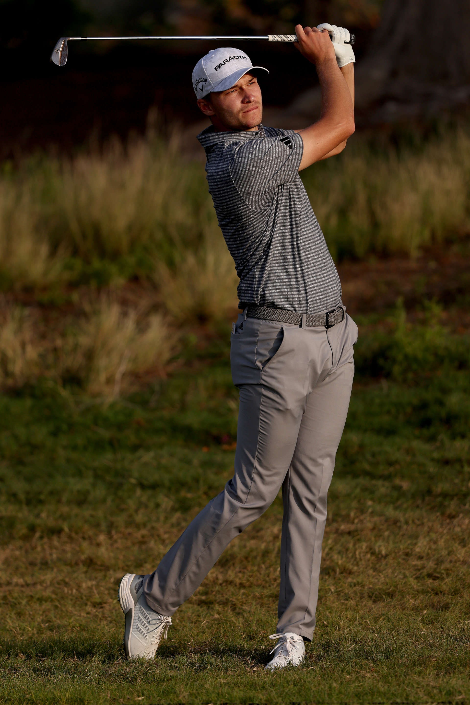RAS AL KHAIMAH, UNITED ARAB EMIRATES - FEBRUARY 03: Rasmus Hojgaard of Denmark plays his second shot from the 17th Hole on Day Two of the Ras Al Khaimah Championship at Al Hamra Golf Club on February 03, 2023 in Ras al Khaimah, United Arab Emirates. (Photo by Warren Little/Getty Images)