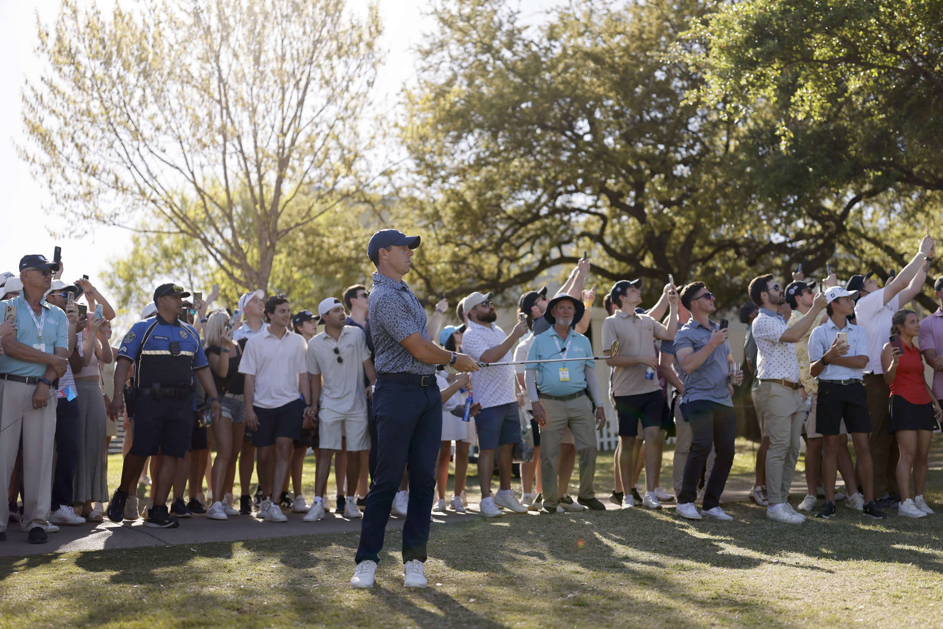 AUSTIN, TEXAS - MARCH 25: Rory McIlroy of Northern Ireland follows his shot on the 18th hole during day four of the World Golf Championships-Dell Technologies Match Play at Austin Country Club on March 25, 2023 in Austin, Texas. (Photo by Mike Mulholland/Getty Images)