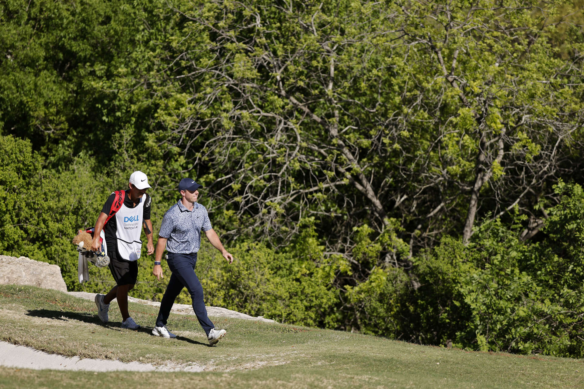 AUSTIN, TEXAS - MARCH 25: Rory McIlroy of Northern Ireland walks across the 17th hole during day four of the World Golf Championships-Dell Technologies Match Play at Austin Country Club on March 25, 2023 in Austin, Texas. (Photo by Mike Mulholland/Getty Images)