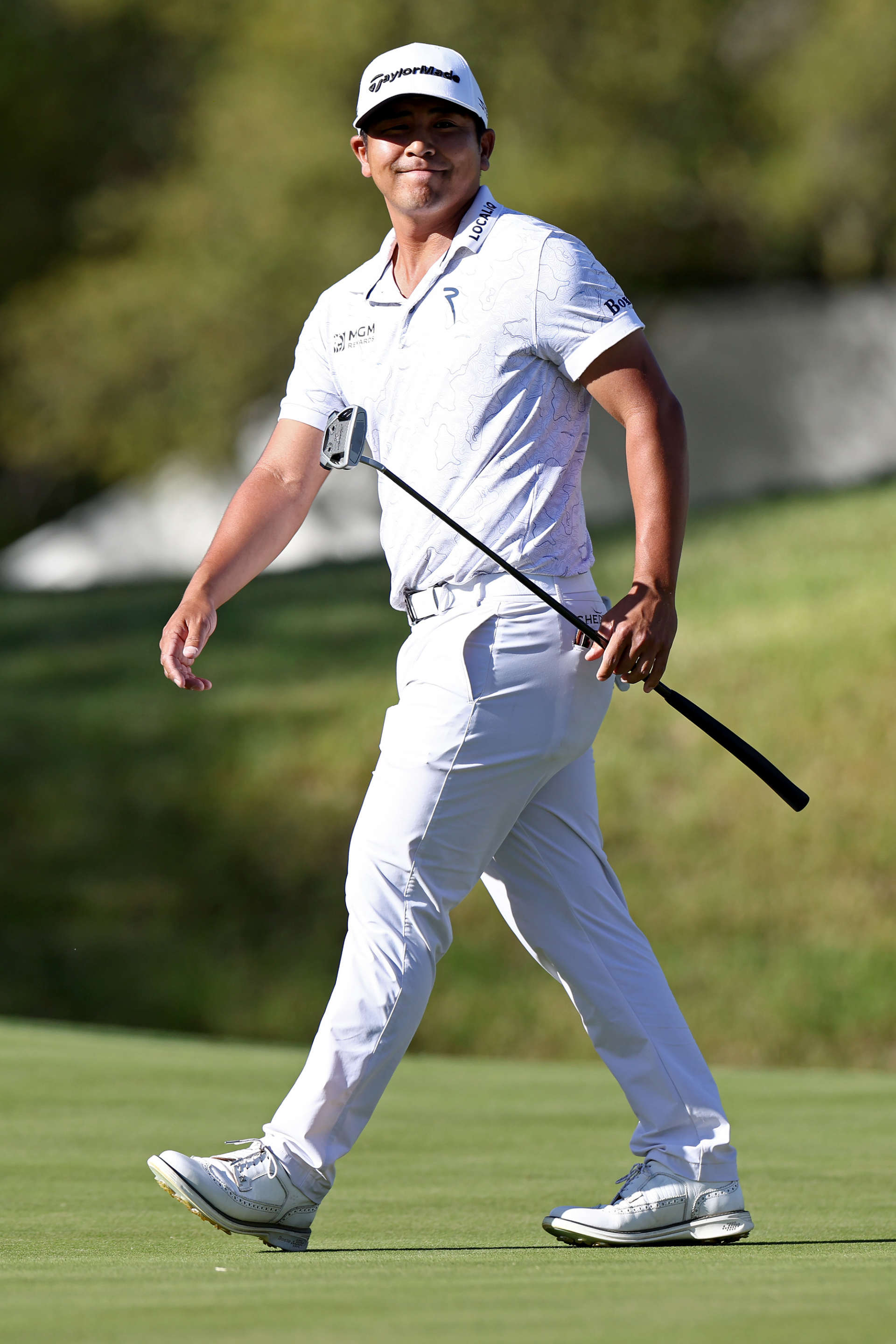 AUSTIN, TEXAS - MARCH 25: Kurt Kitayama of the United States walks across the 18th green during day four of the World Golf Championships-Dell Technologies Match Play at Austin Country Club on March 25, 2023 in Austin, Texas. (Photo by Tom Pennington/Getty Images)