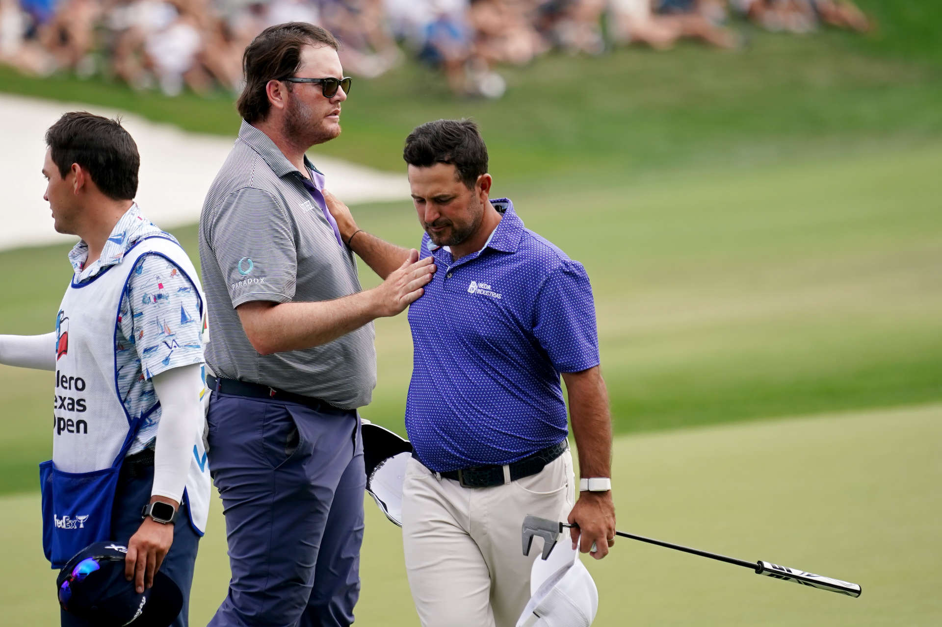 SAN ANTONIO, TEXAS - APRIL 01: Harry Higgs of the United States (L) and Roberto Diaz of Mexico meet on the 18th green after finishing their round during the third round of the Valero Texas Open at TPC San Antonio on April 01, 2023 in San Antonio, Texas. (Photo by Alex Bierens de Haan/Getty Images)