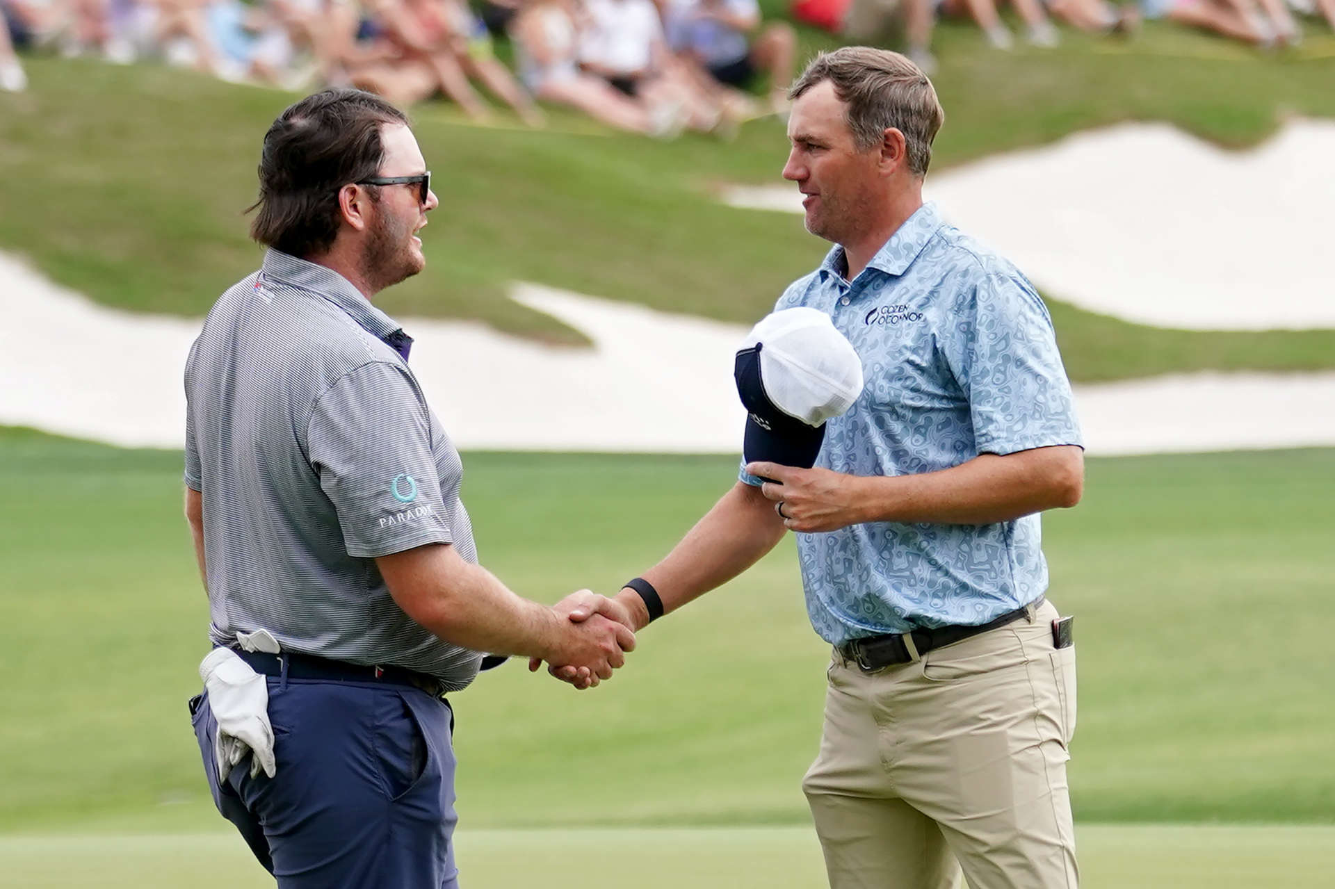 SAN ANTONIO, TEXAS - APRIL 01: Harry Higgs of the United States (L) and Brendon Todd of the United States shake hands on the 18th green after finishing their round during the third round of the Valero Texas Open at TPC San Antonio on April 01, 2023 in San Antonio, Texas. (Photo by Alex Bierens de Haan/Getty Images)