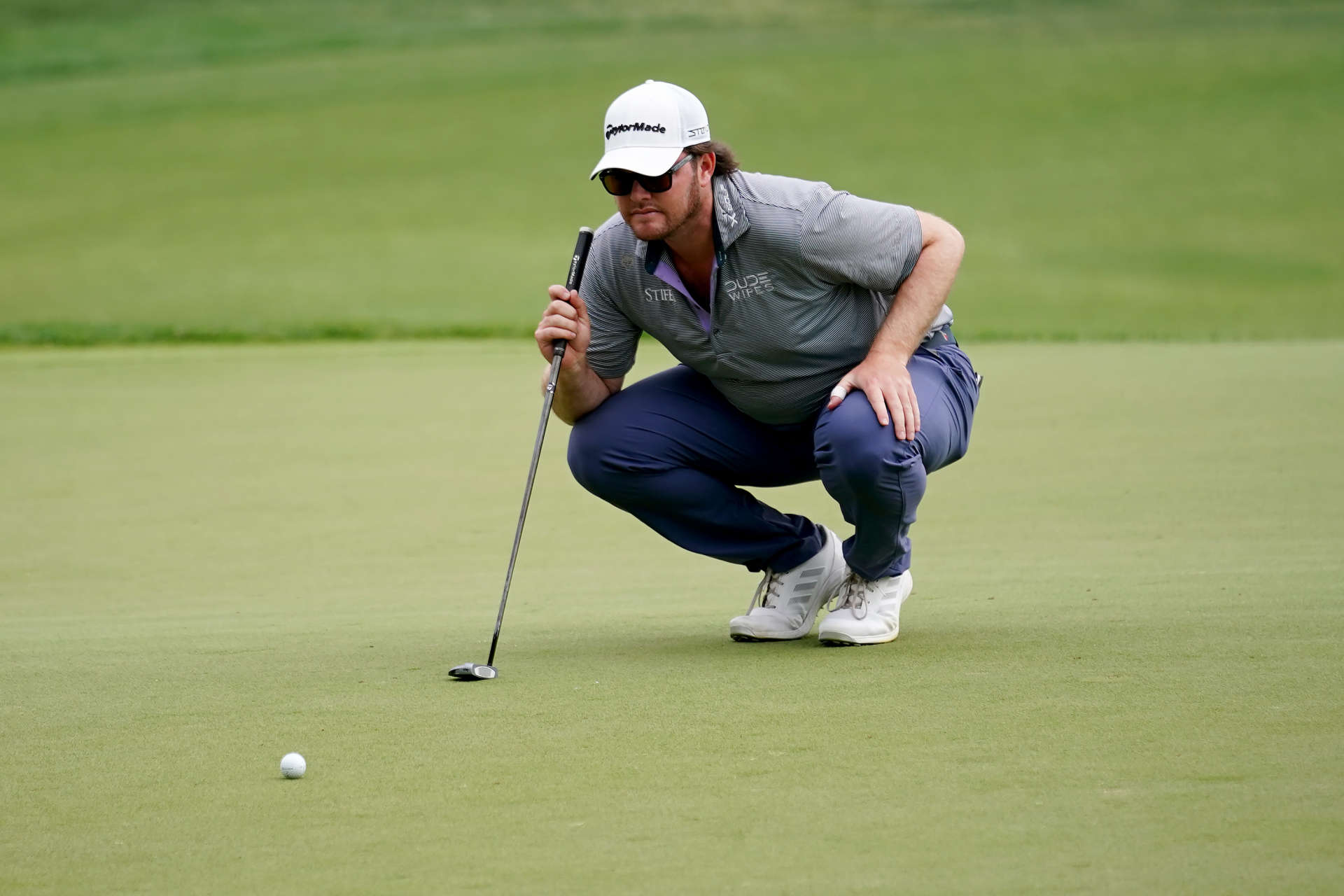 SAN ANTONIO, TEXAS - APRIL 01: Harry Higgs of the United States lines up a putt on the 18th green during the third round of the Valero Texas Open at TPC San Antonio on April 01, 2023 in San Antonio, Texas. (Photo by Alex Bierens de Haan/Getty Images)