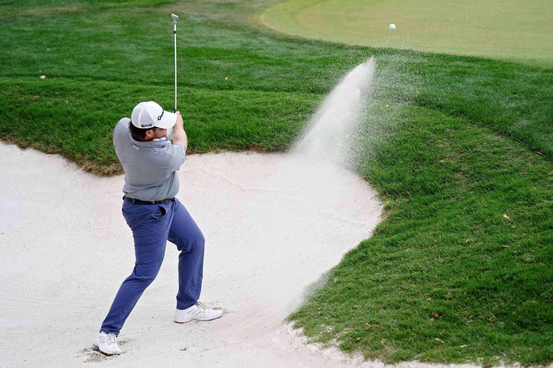 SAN ANTONIO, TEXAS - APRIL 01: Harry Higgs of the United States plays his shot from the bunker on the 18th hole during the third round of the Valero Texas Open at TPC San Antonio on April 01, 2023 in San Antonio, Texas. (Photo by Alex Bierens de Haan/Getty Images)