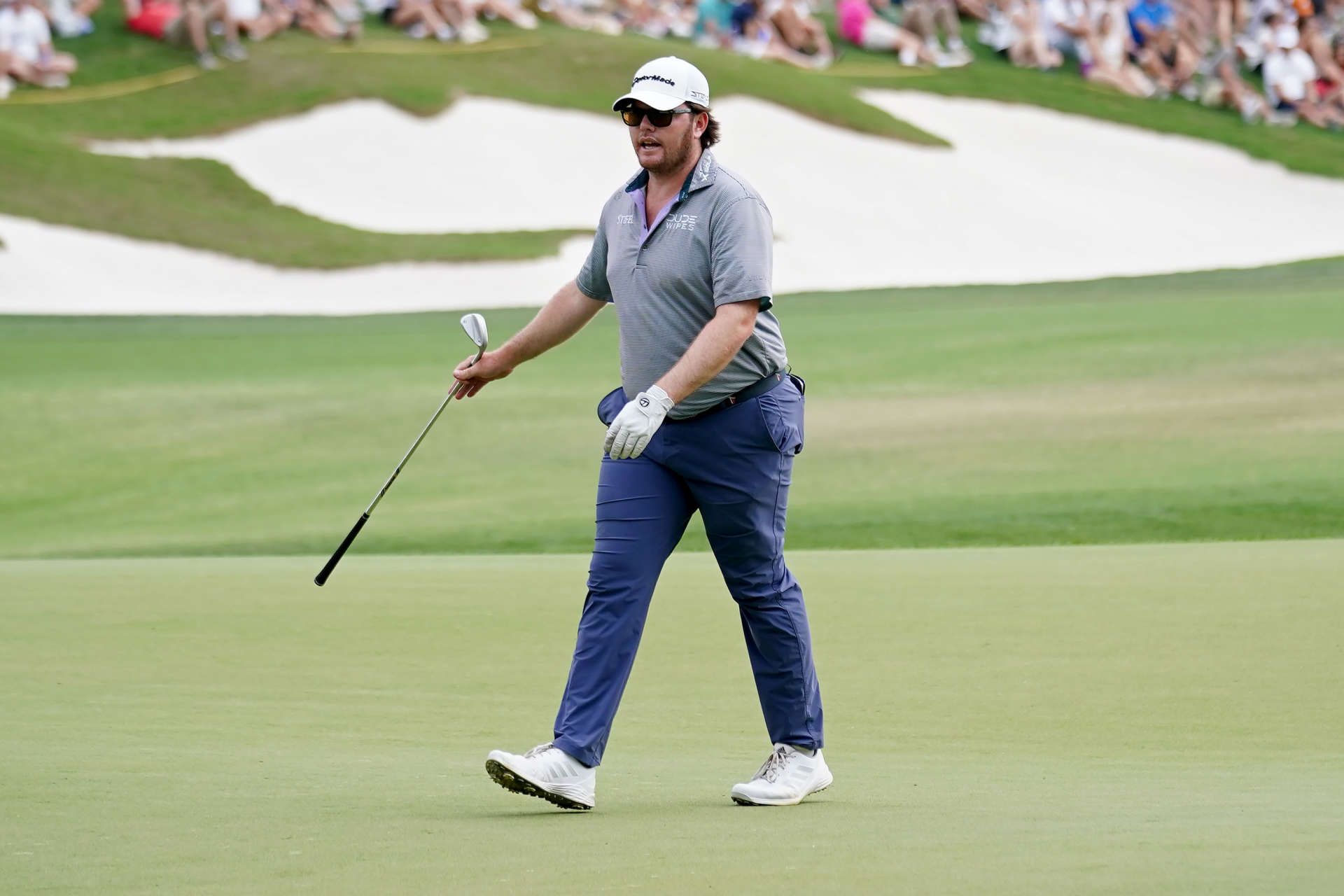 SAN ANTONIO, TEXAS - APRIL 01: Harry Higgs of the United States walks across the 18th green during the third round of the Valero Texas Open at TPC San Antonio on April 01, 2023 in San Antonio, Texas. (Photo by Alex Bierens de Haan/Getty Images)