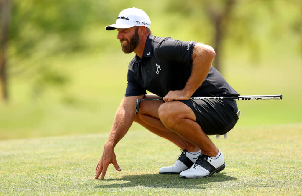 ORLANDO, FLORIDA - APRIL 02: Captain Dustin Johnson of Aces GC lines up a putt on the second hole during day three of the LIV Golf Invitational - Orlando at The Orange County National on April 02, 2023 in Orlando, Florida. (Photo by Mike Ehrmann/Getty Images)