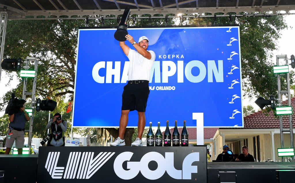ORLANDO, FLORIDA - APRIL 02: Captain Brooks Koepka of Smash GC celebrates with the trophy after winning the LIV Golf Invitational - Orlando at The Orange County National on April 02, 2023 in Orlando, Florida. (Photo by Mike Ehrmann/Getty Images)