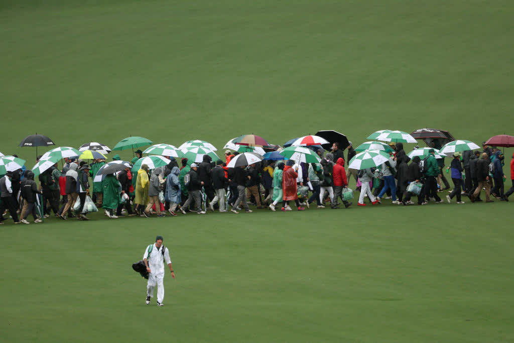 AUGUSTA, GEORGIA - APRIL 08: Patrons cross the seventh fairway during the third round of the 2023 Masters Tournament at Augusta National Golf Club on April 08, 2023 in Augusta, Georgia. (Photo by Patrick Smith/Getty Images)