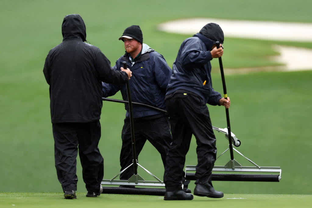 AUGUSTA, GEORGIA - APRIL 08: Greenskeepers clears water from the seventh green during the third round of the 2023 Masters Tournament at Augusta National Golf Club on April 08, 2023 in Augusta, Georgia. (Photo by Andrew Redington/Getty Images)