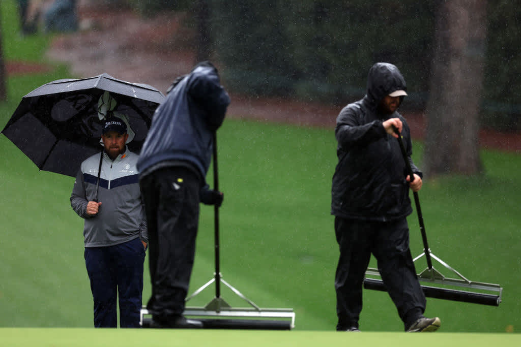 AUGUSTA, GEORGIA - APRIL 08: Shane Lowry of Ireland looks on as greenskeepers remove water from the tenth green during the third round of the 2023 Masters Tournament at Augusta National Golf Club on April 08, 2023 in Augusta, Georgia. (Photo by Andrew Redington/Getty Images)