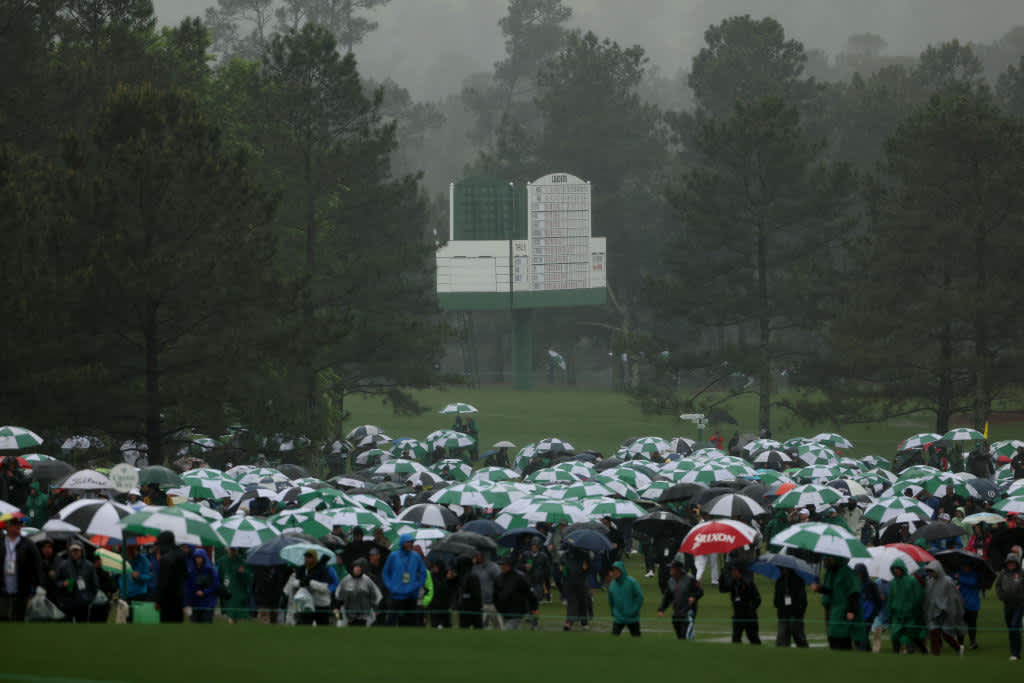 AUGUSTA, GEORGIA - APRIL 08: Patrons evacuate the grounds after play was suspended for the day due to weather conditions during the third round of the 2023 Masters Tournament at Augusta National Golf Club on April 08, 2023 in Augusta, Georgia. (Photo by Patrick Smith/Getty Images)