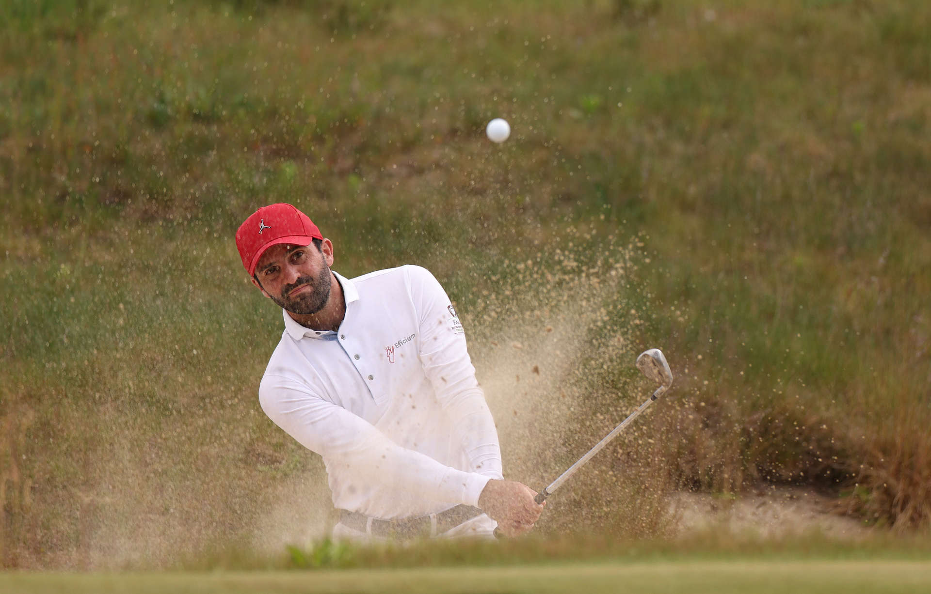 CROMVOIRT, NETHERLANDS - MAY 25: Joel Stalter of France plays a bunker shot on the sixth hole during Day One of the KLM Open at Bernardus Golf on May 25, 2023 in Netherlands. (Photo by Dean Mouhtaropoulos/Getty Images)