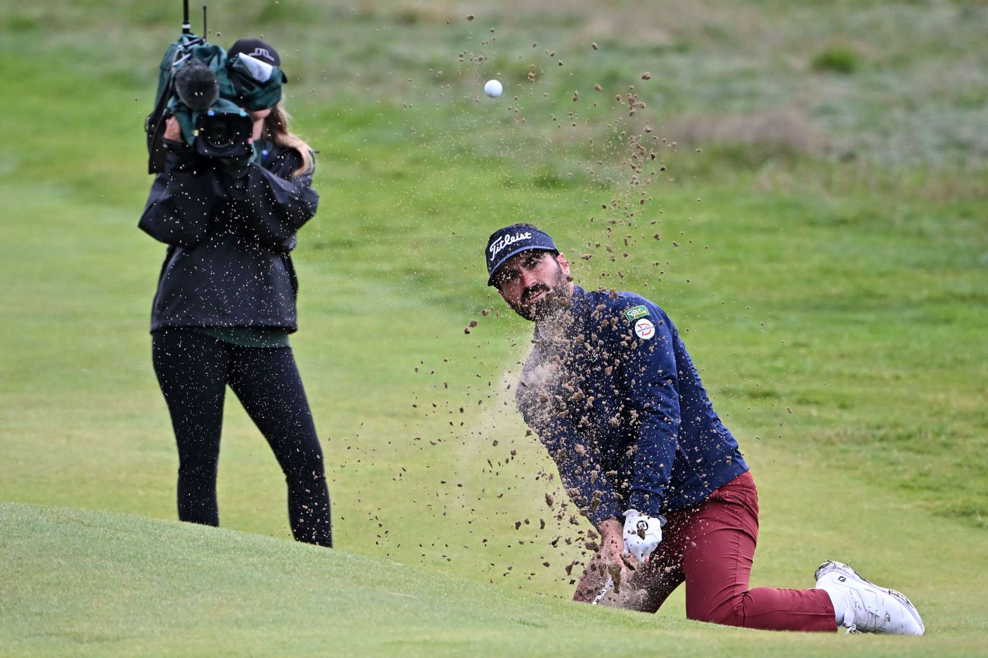 Frenchman Antoine Rozner struggles with the difficult bunkers at Royal Liverpool GC. He is also at four under par.