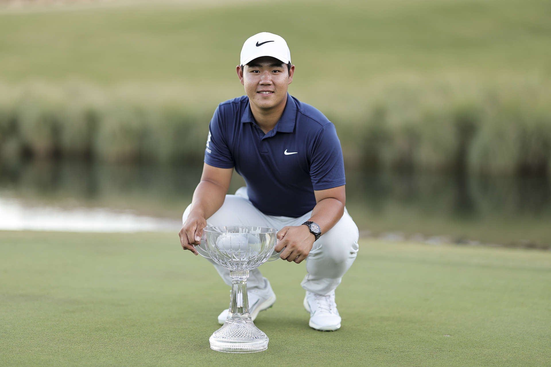 LAS VEGAS, NEVADA - OCTOBER 15: Tom Kim of South Korea poses with the trophy after putting in to win on the 18th green during the final round of the Shriners Children's Open at TPC Summerlin on October 15, 2023 in Las Vegas, Nevada. (Photo by Michael Owens/Getty Images)