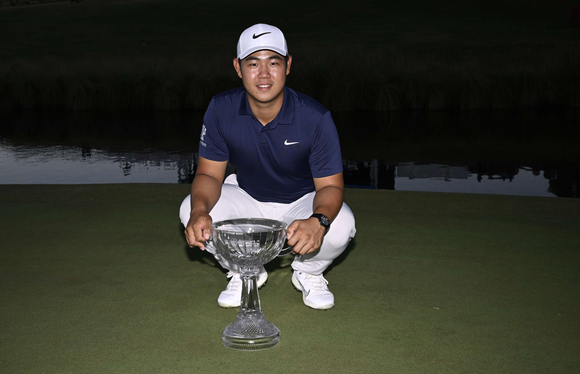LAS VEGAS, NEVADA - OCTOBER 15: Tom Kim of South Korea poses with the trophy after putting in to win on the 18th green during the final round of the Shriners Children's Open at TPC Summerlin on October 15, 2023 in Las Vegas, Nevada. (Photo by Orlando Ramirez/Getty Images)