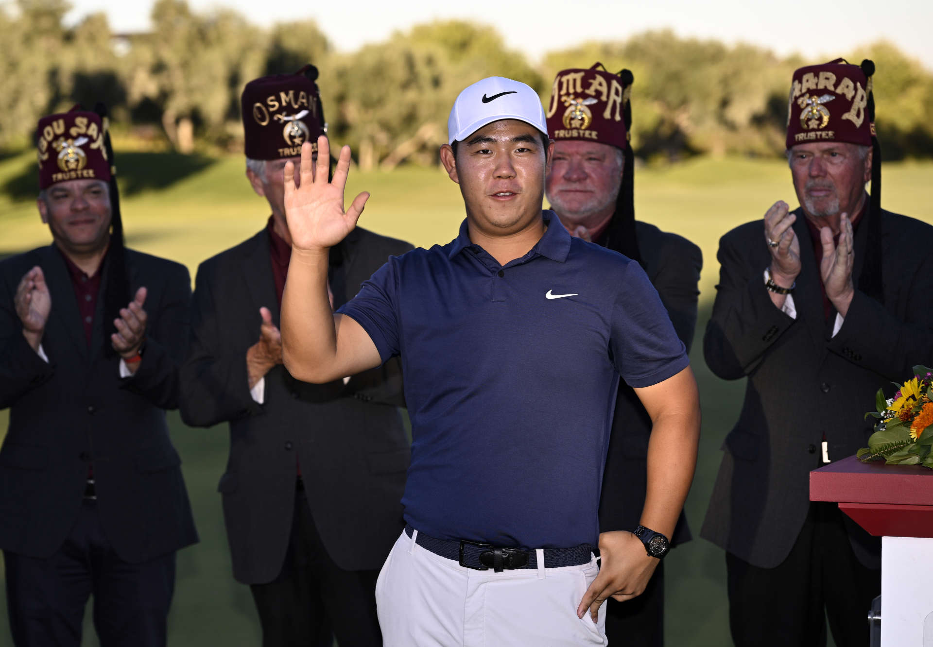 LAS VEGAS, NEVADA - OCTOBER 15: Tom Kim of South Korea walks onto the 18th green for the trophy presentation after putting in to winduring the final round of the Shriners Children's Open at TPC Summerlin on October 15, 2023 in Las Vegas, Nevada. (Photo by Orlando Ramirez/Getty Images)