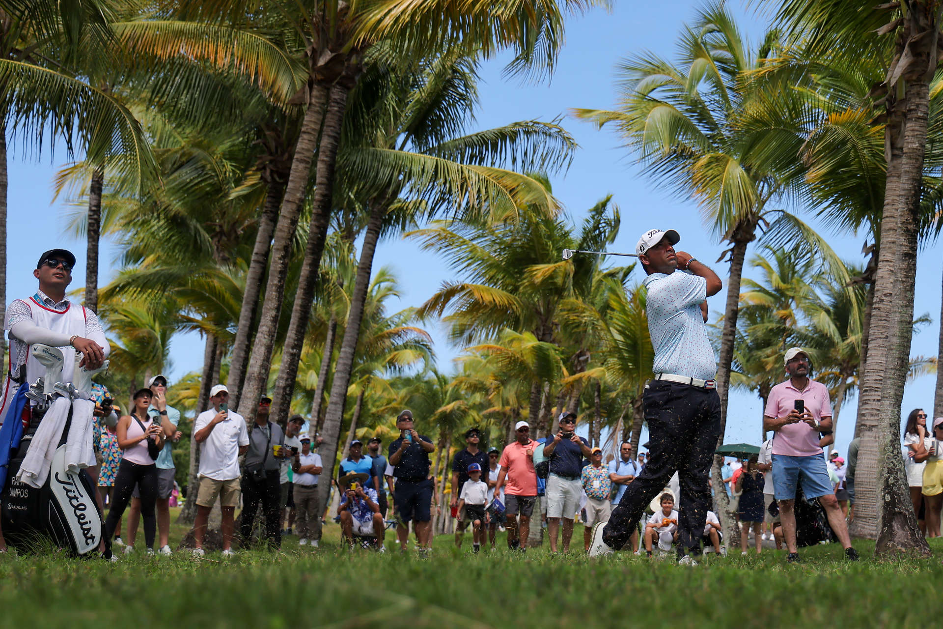 RIO GRANDE, PUERTO RICO - MARCH 09: Rafael Campos of Puerto Rico plays an approach shot on the second hole as fans look on during the third round of the Puerto Rico Open at Grand Reserve Golf Club on March 09, 2024 in Rio Grande, Puerto Rico. (Photo by Jonathan Bachman/Getty Images)