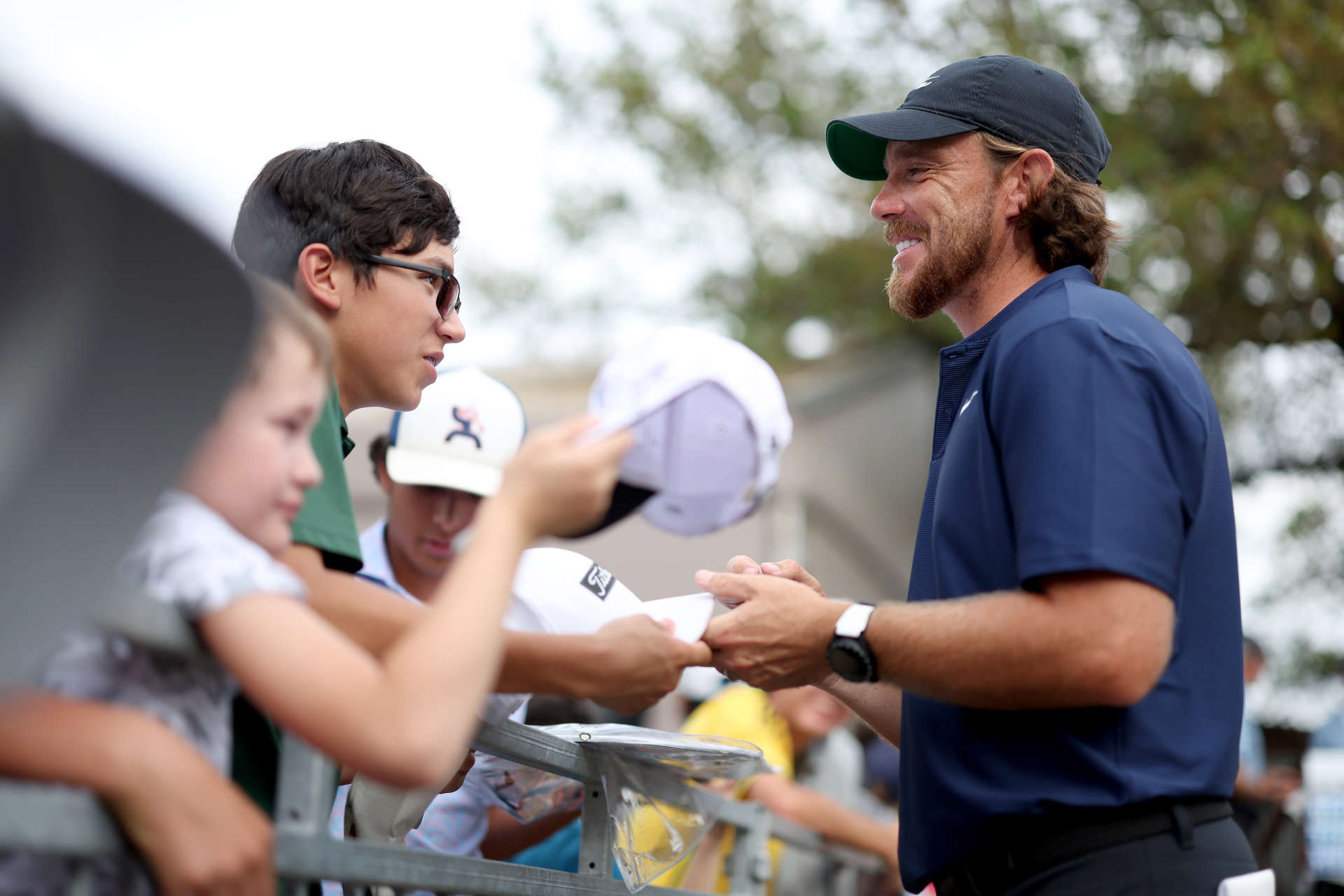 SAN ANTONIO, TEXAS - APRIL 06: Tommy Fleetwood of England signs autographs to the crowd during the third round of the Valero Texas Open at TPC San Antonio on April 06, 2024 in San Antonio, Texas. (Photo by Brennan Asplen/Getty Images)