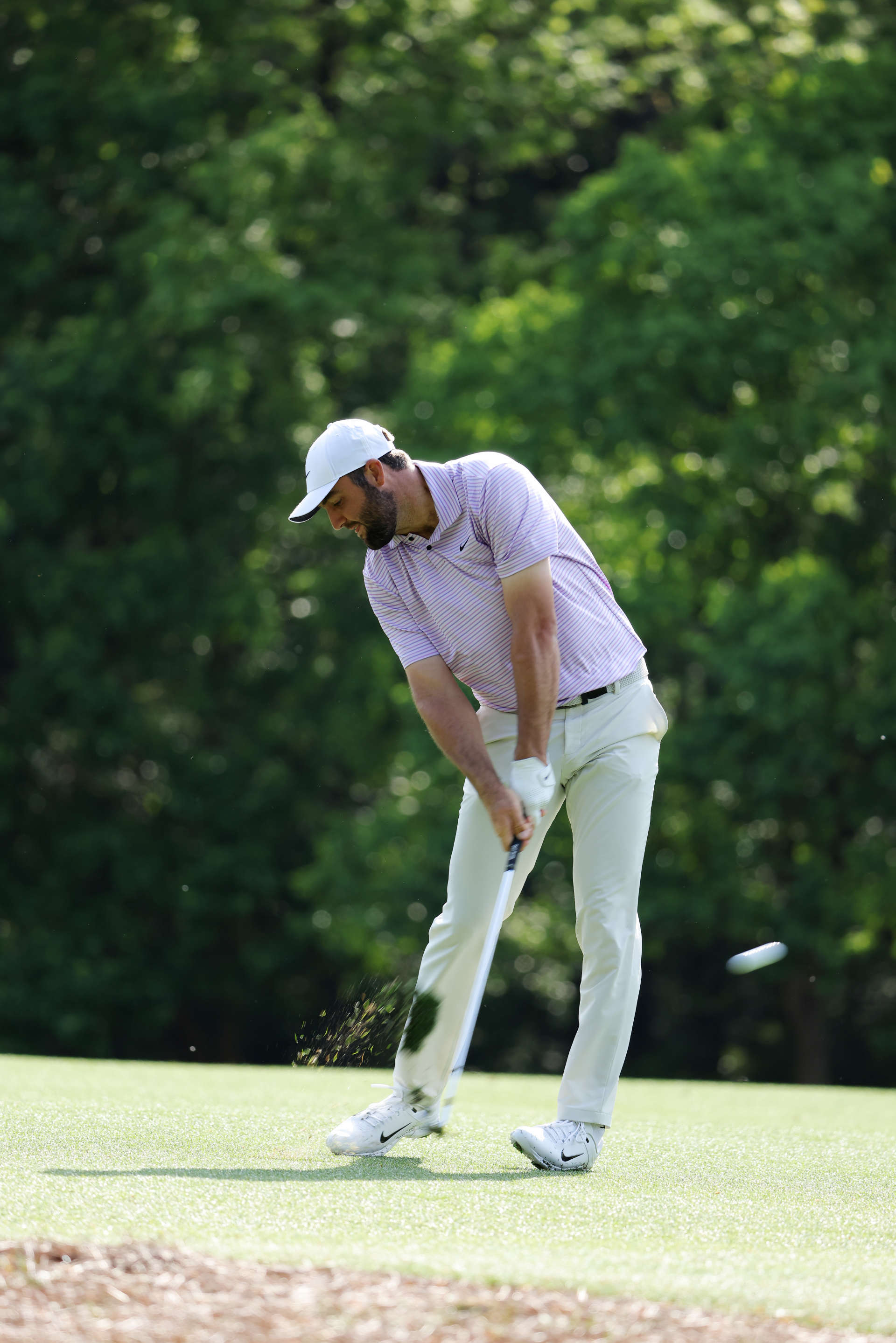 AUGUSTA, GEORGIA - APRIL 10: Scottie Scheffler of the United States plays his shot from the 11th hole during a practice round prior to the 2024 Masters Tournament at Augusta National Golf Club on April 10, 2024 in Augusta, Georgia. (Photo by Jamie Squire/Getty Images) (Photo by Jamie Squire/Getty Images)