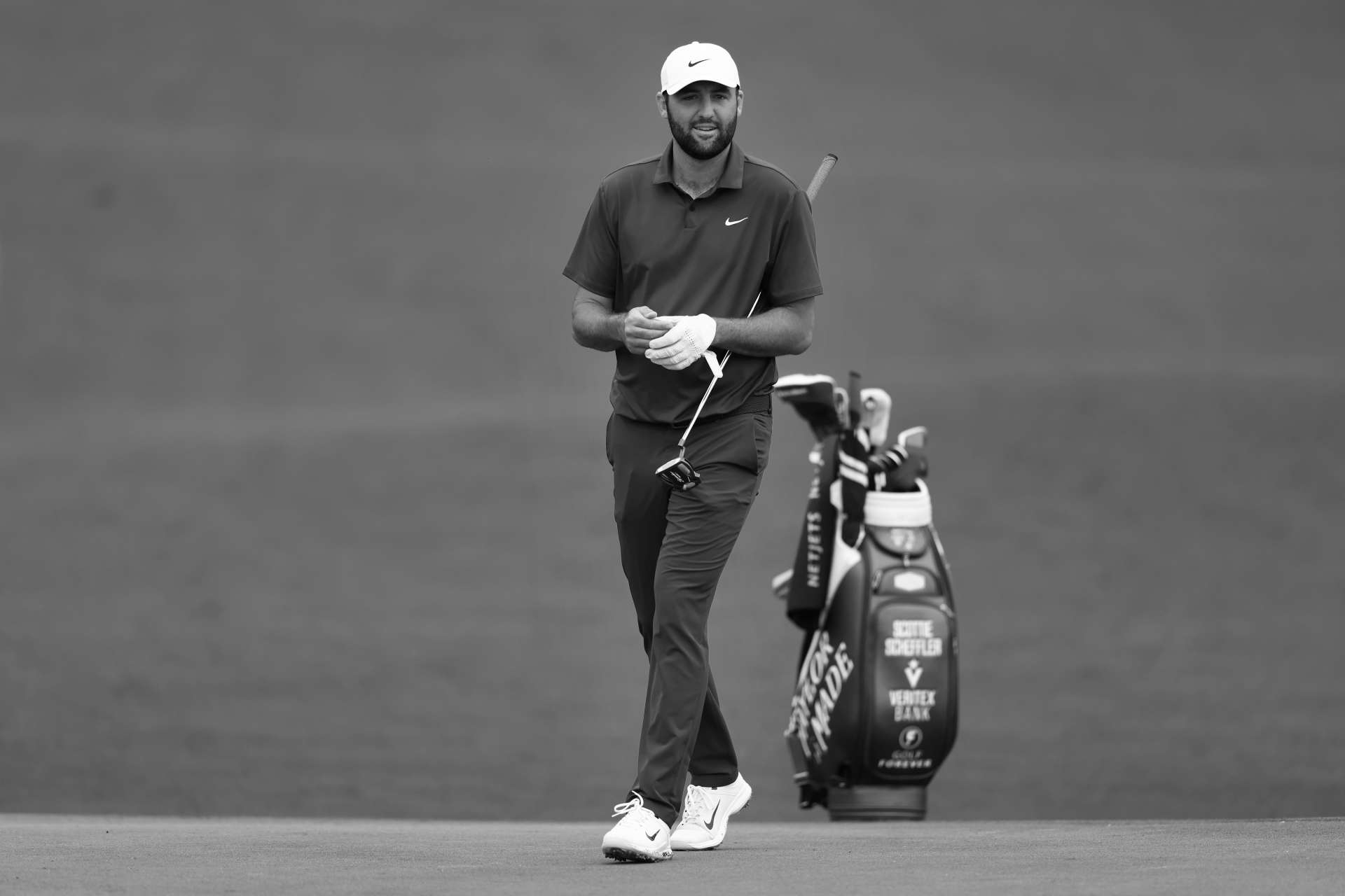 AUGUSTA, GEORGIA - APRIL 09: (EDITOR'S NOTE:This image has been converted to black and white.) Scottie Scheffler of the United States walks on the second hole during a practice round prior to the 2024 Masters Tournament at Augusta National Golf Club on April 09, 2024 in Augusta, Georgia. (Photo by Maddie Meyer/Getty Images)