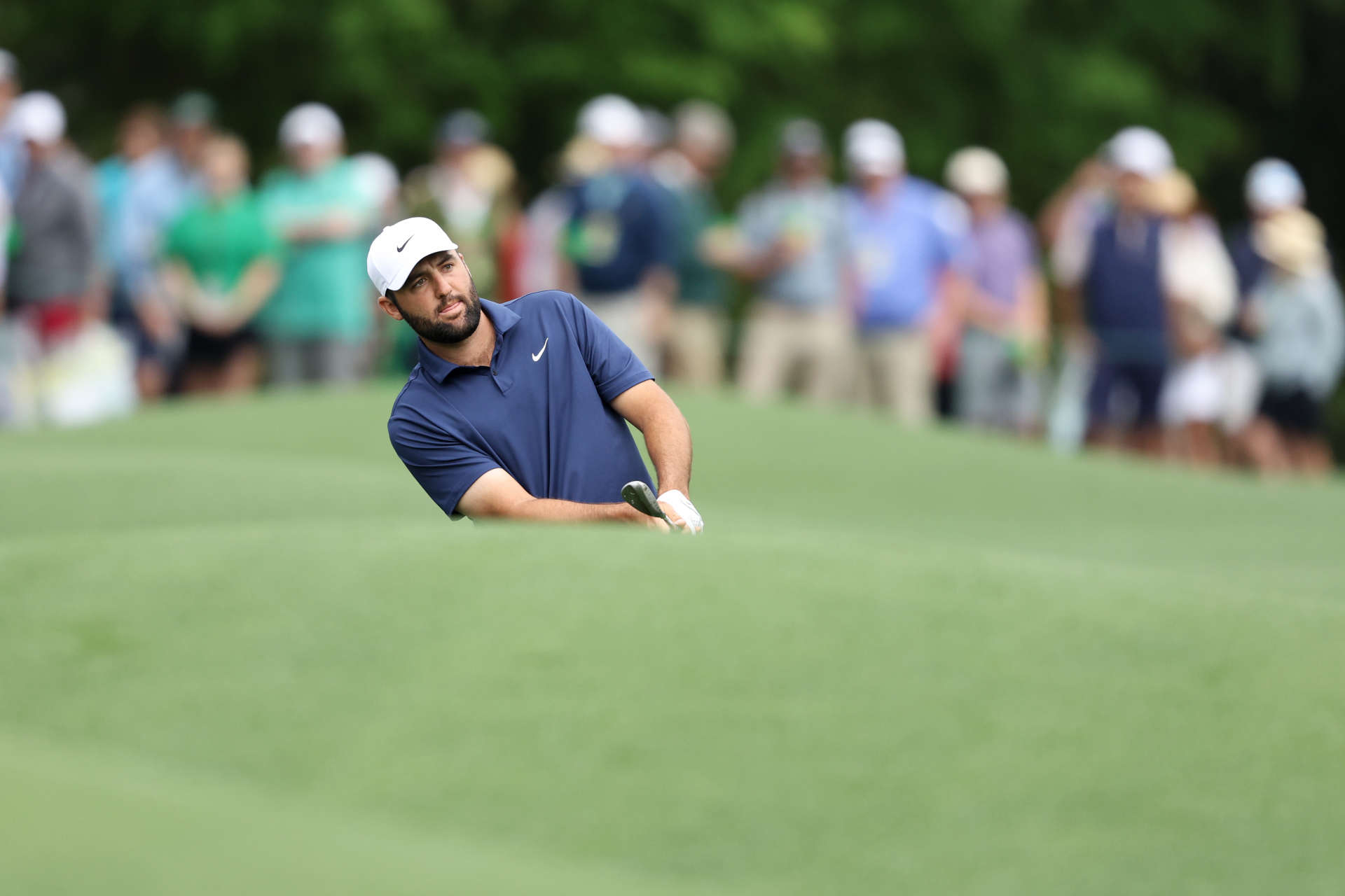 AUGUSTA, GEORGIA - APRIL 09: Scottie Scheffler of the United States chips to the eighth green during a practice round prior to the 2024 Masters Tournament at Augusta National Golf Club on April 09, 2024 in Augusta, Georgia. (Photo by Warren Little/Getty Images)