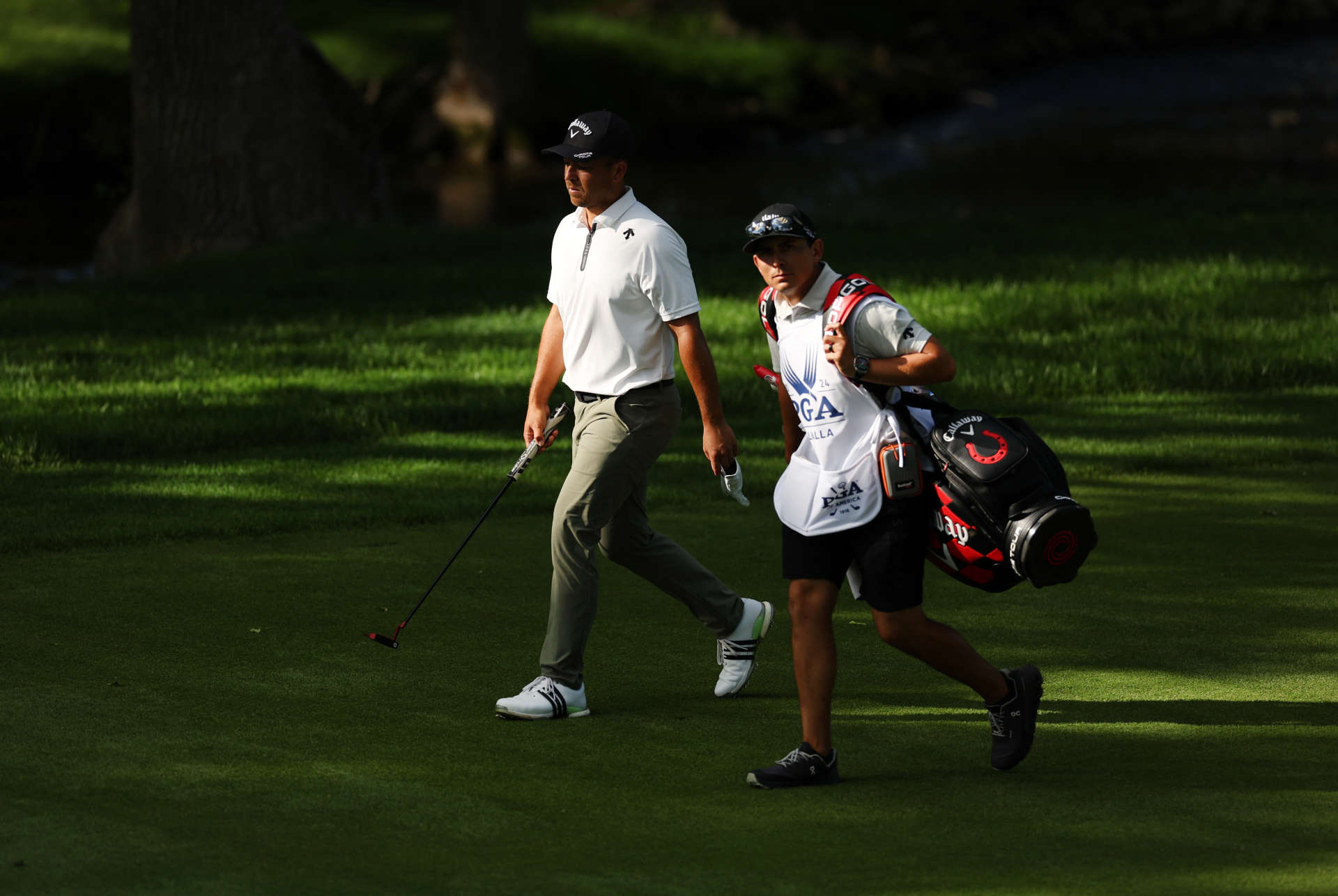 LOUISVILLE, KENTUCKY - MAY 18: Xander Schauffele of the United States and his caddie, Austin Kaiser, walk on the 16th fairway during the third round of the 2024 PGA Championship at Valhalla Golf Club on May 18, 2024 in Louisville, Kentucky. (Photo by Christian Petersen/Getty Images)