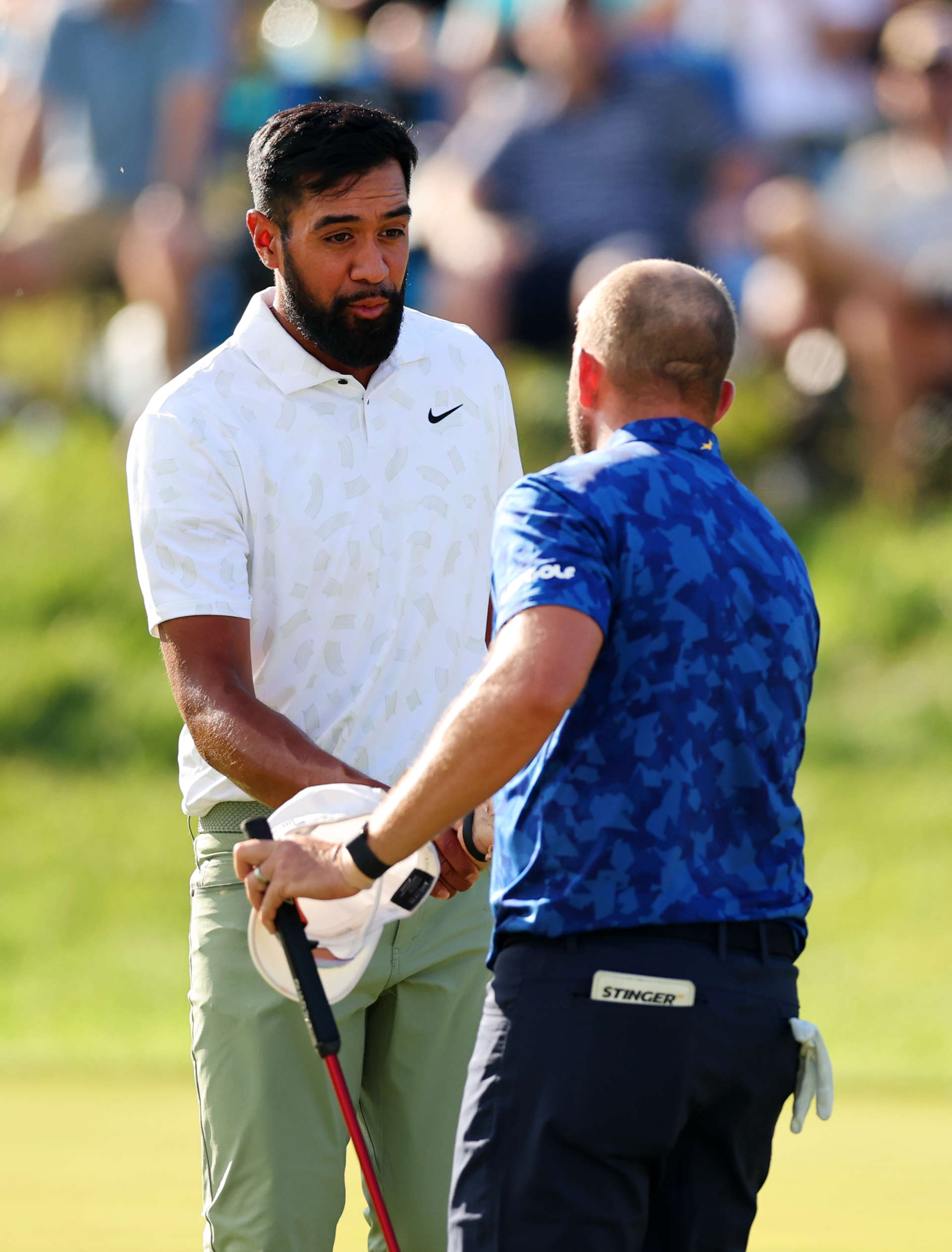 LOUISVILLE, KENTUCKY - MAY 18: Tony Finau of the United States shakes hands with Dean Burmester of South Africa on the 18th hole during the third round of the 2024 PGA Championship at Valhalla Golf Club on May 18, 2024 in Louisville, Kentucky. (Photo by Michael Reaves/Getty Images)