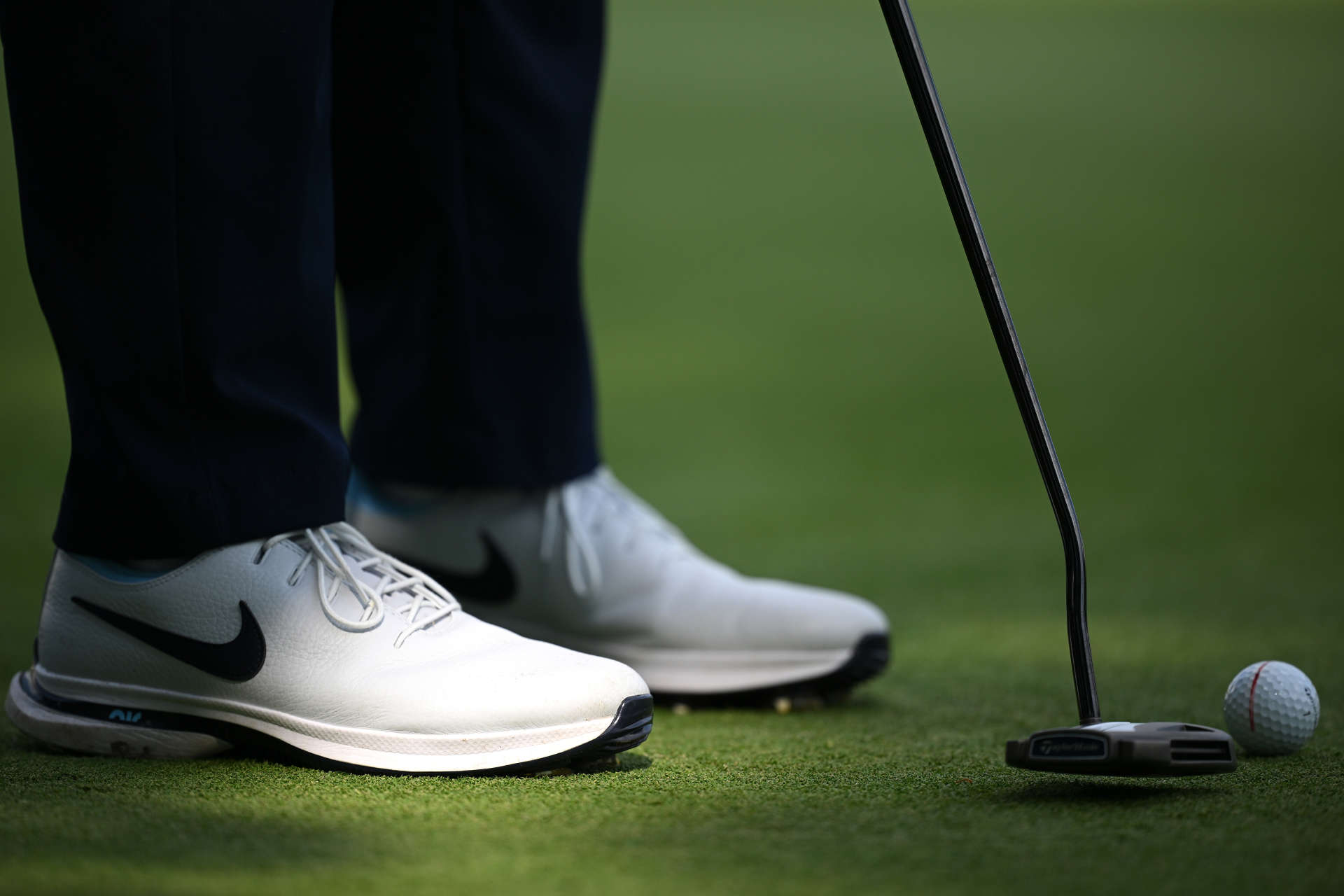 HAMBURG, GERMANY - JUNE 01: The shoes of Tom Vaillant of France as he putts on the 17th green during the third round of the European Open at Green Eagle Golf Course on June 01, 2024 in Winsen, Germany.  (Photo by Stuart Franklin/Getty Images)
