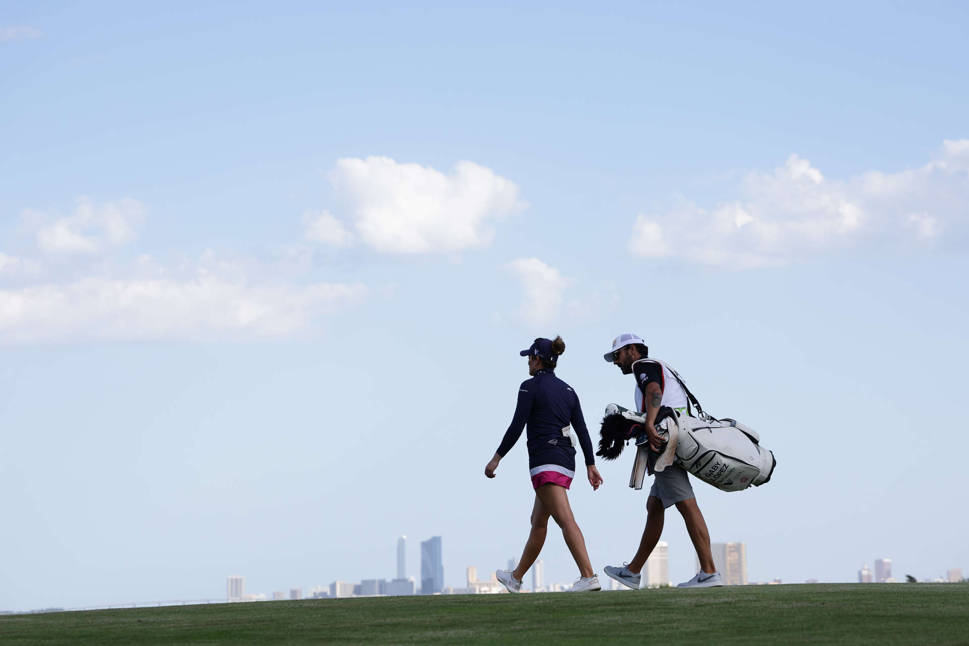 GALLOWAY, NEW JERSEY - JUNE 07: Gaby Lopez of Mexico and her caddie walk the sixth fairway during the first round of the ShopRite LPGA Classic Presented by Acer at Seaview Bay Course on June 07, 2024 in Galloway, New Jersey. (Photo by Hunter Martin/Getty Images)