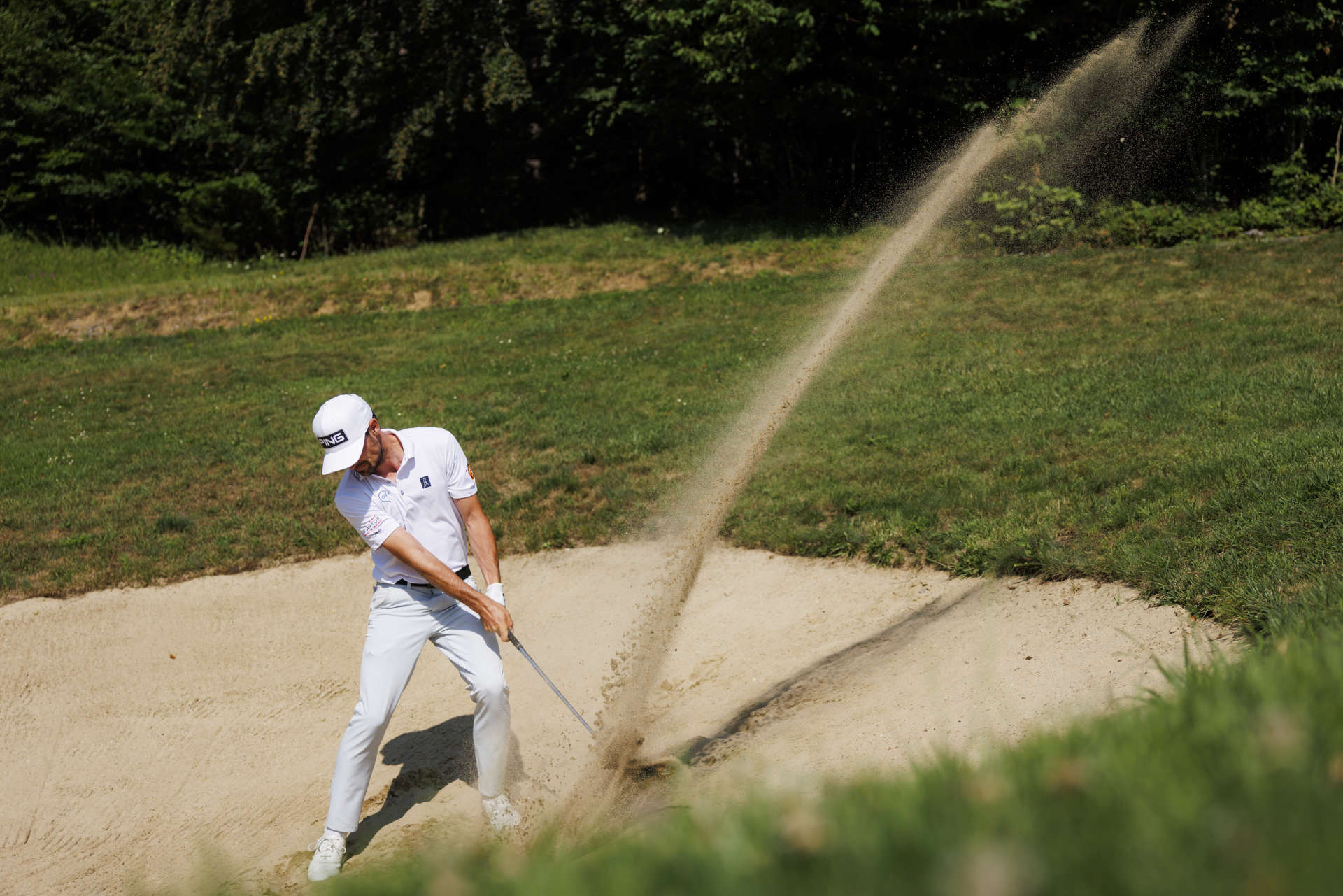 RAMSAU, AUSTRIA - JULY 19: Quim Vidal of Spain hits his second shot out of a bunker at the third hole during day two of the Euram Bank Open at GC Adamstal on July 19, 2024 in Ramsau, Austria. (Photo by Jan Hetfleisch/Getty Images)