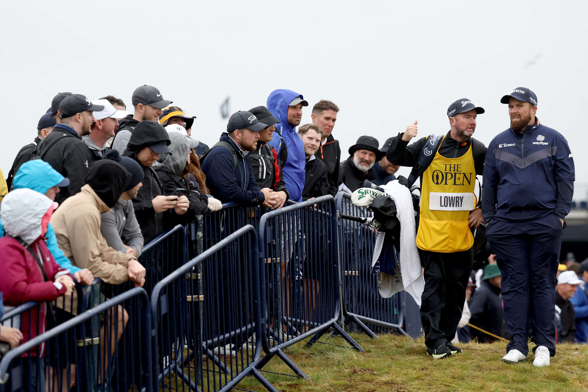 TROON, SCOTLAND - JULY 20: Shane Lowry of Ireland and his caddie Darren Reynolds walk on the 18th hole during day three of The 152nd Open championship at Royal Troon on July 20, 2024 in Troon, Scotland. (Photo by Warren Little/Getty Images)